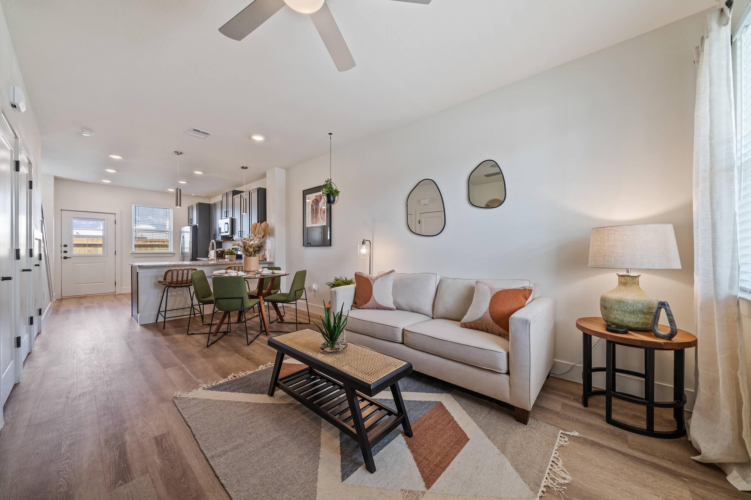 a living room filled with furniture and a fireplace