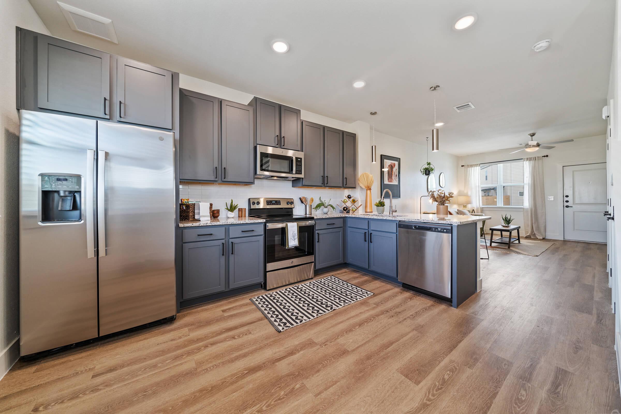 a kitchen with a wood floor