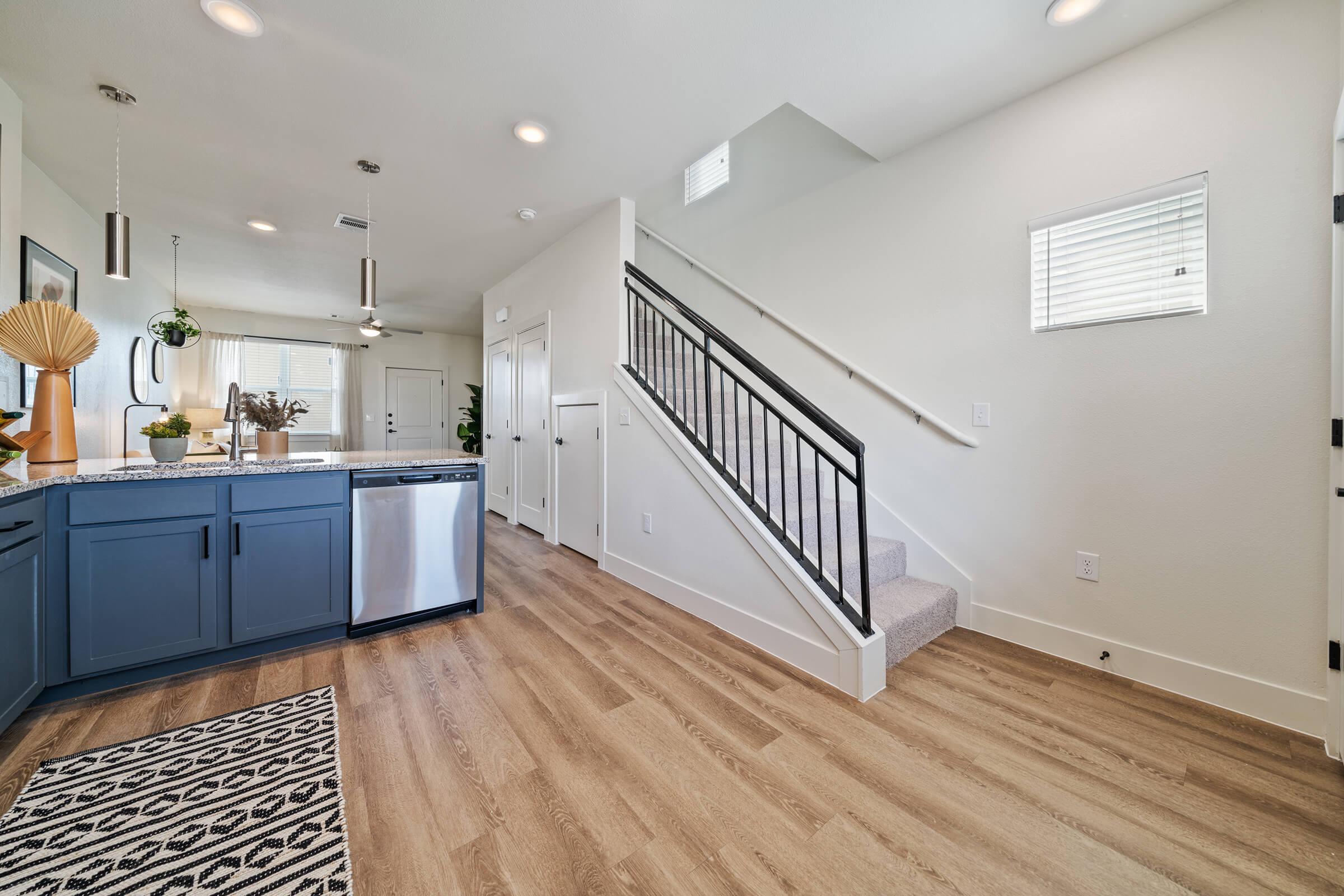 a kitchen with a wood floor