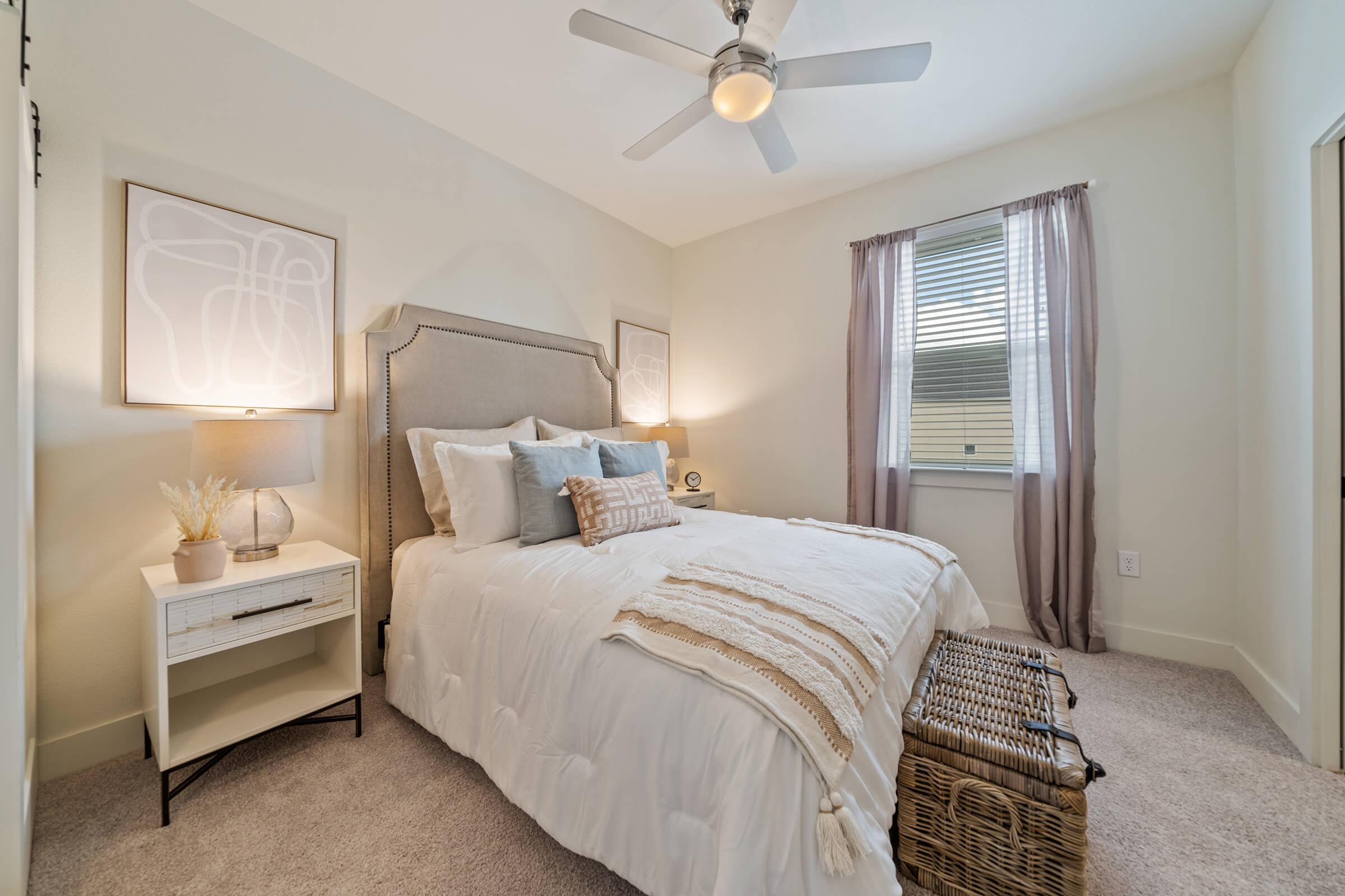 a bedroom with a large bed in a hotel room