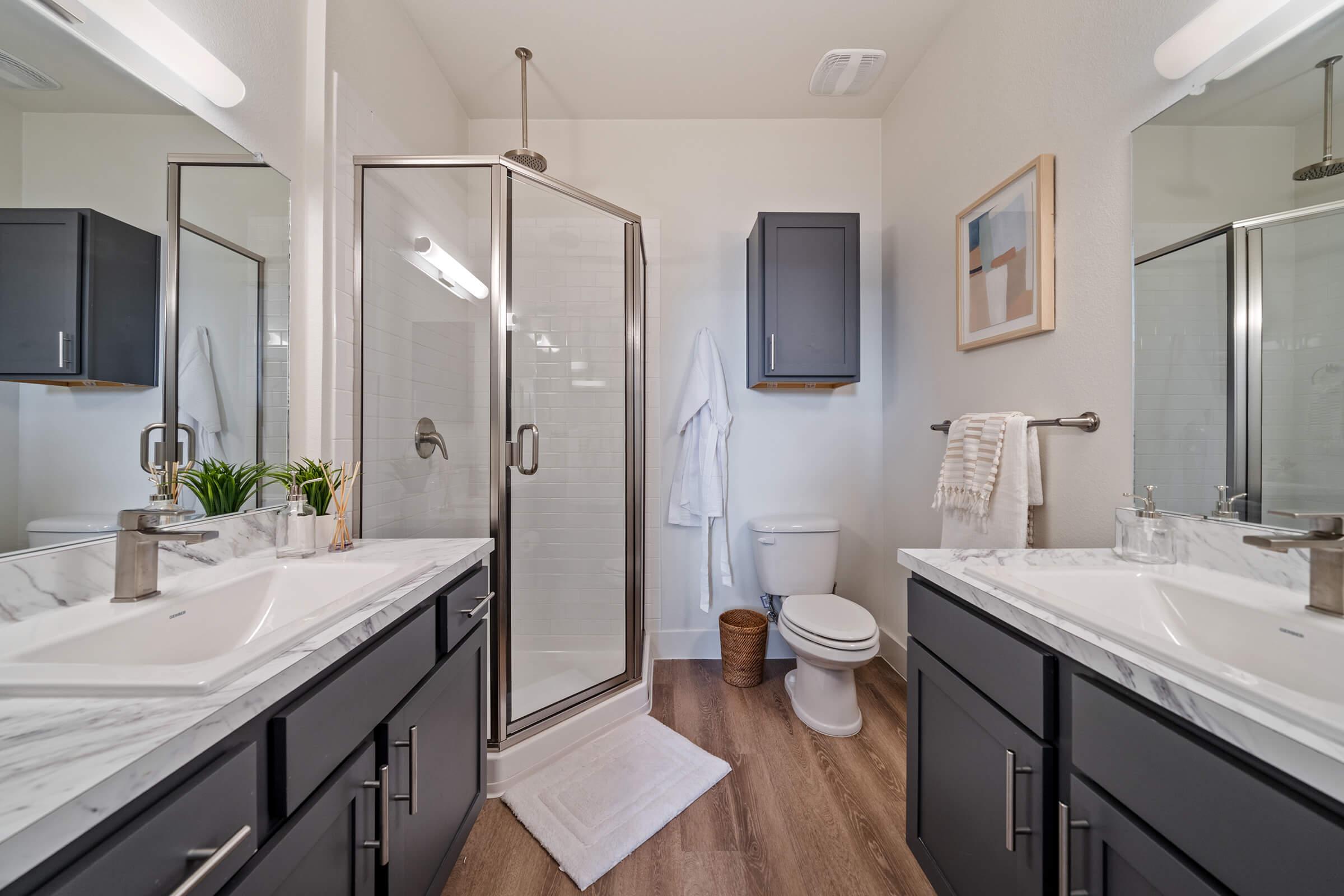 a double sink and large mirror