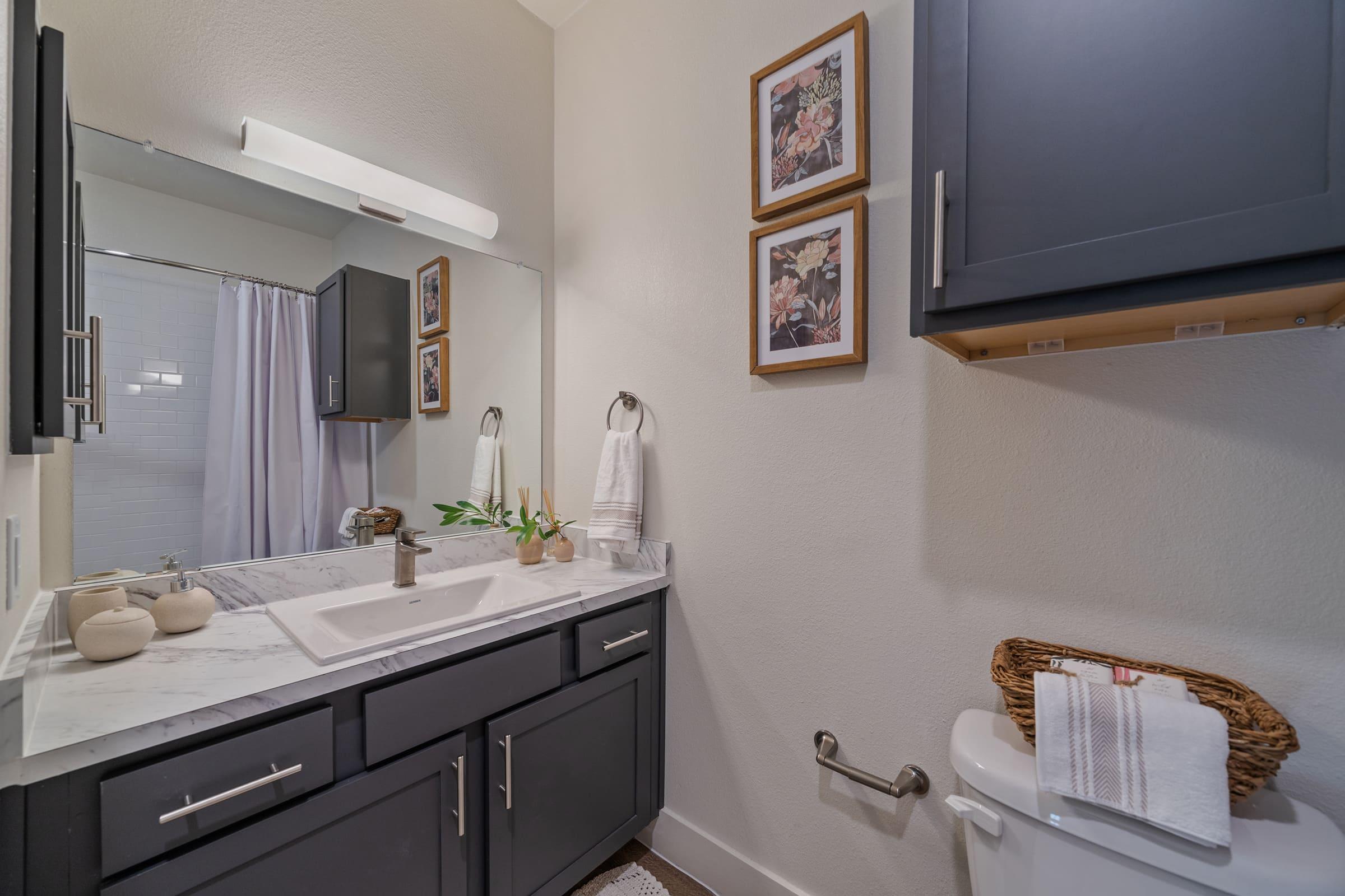 a kitchen with a sink and a mirror