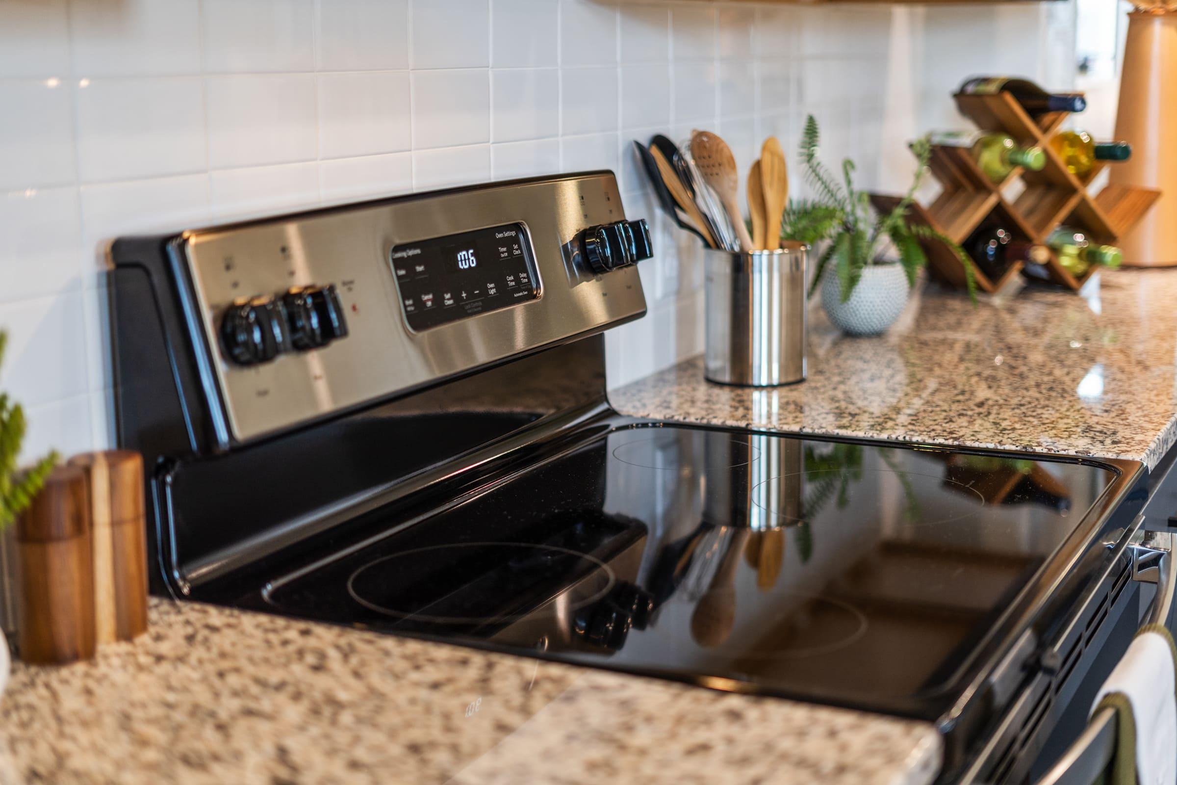 a stove top oven sitting inside of a kitchen