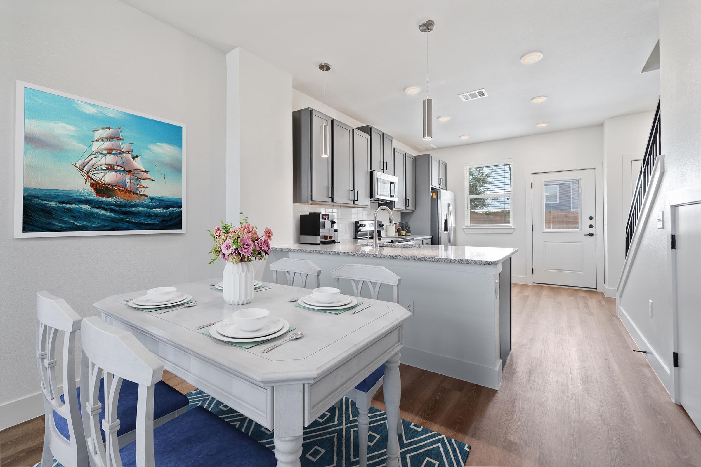 a kitchen with a table in a room