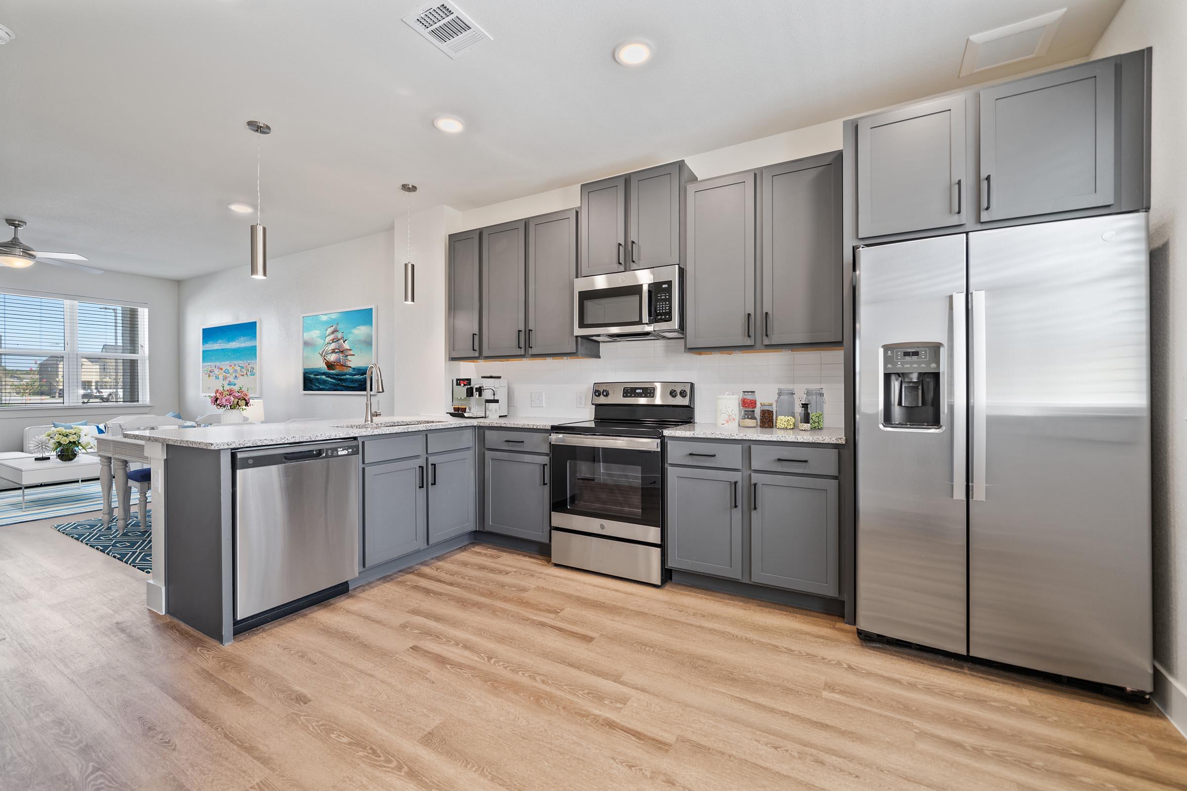 a large kitchen with stainless steel appliances