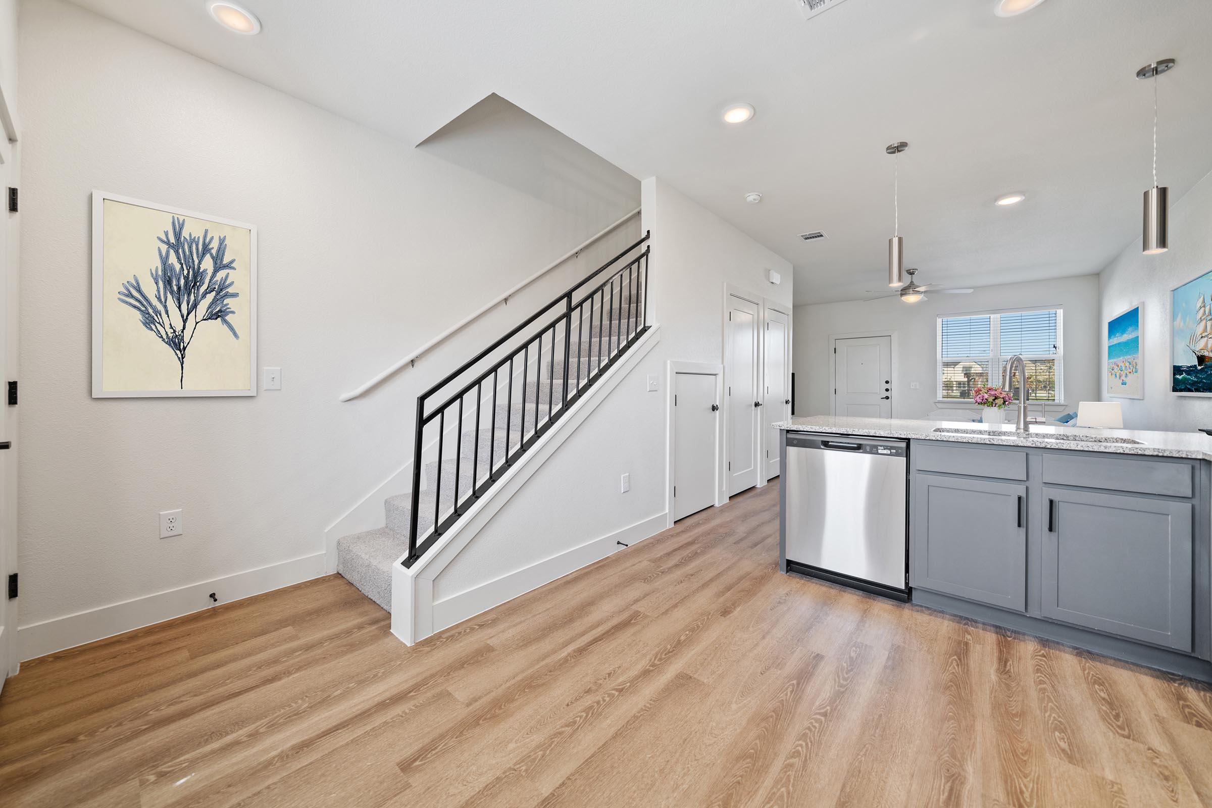 a kitchen with a wood floor