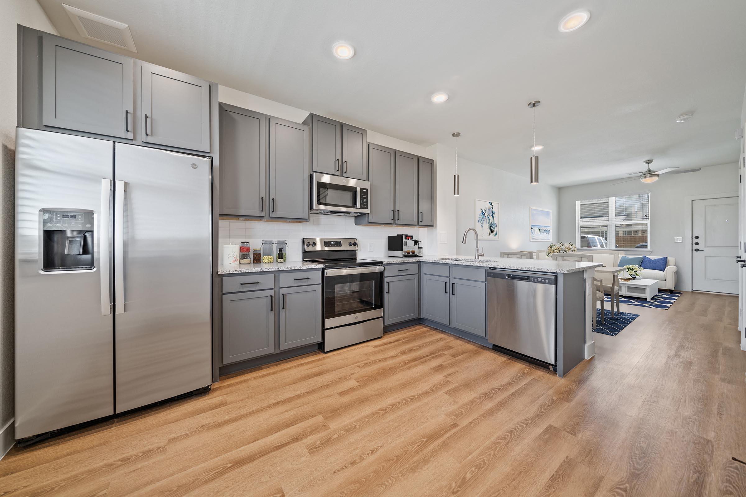 a large kitchen with stainless steel appliances