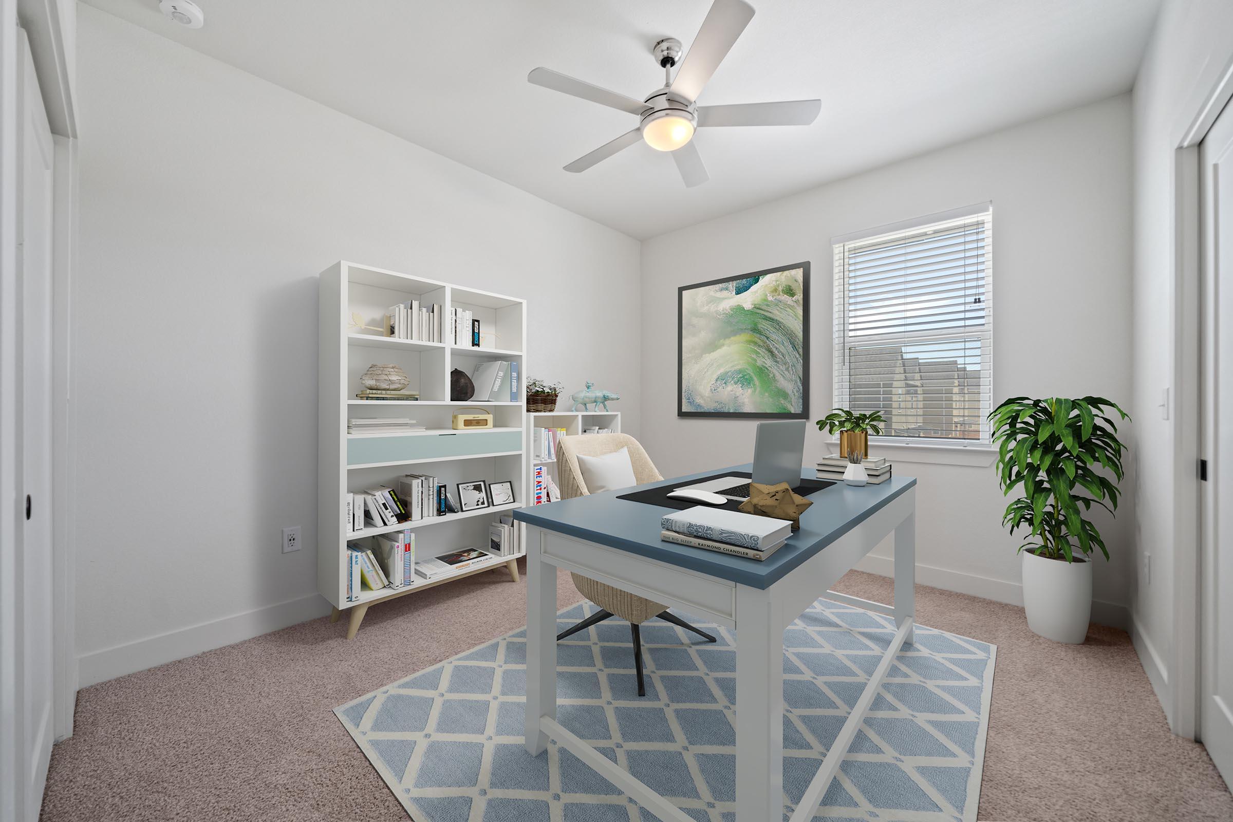 a living room filled with furniture and a large window