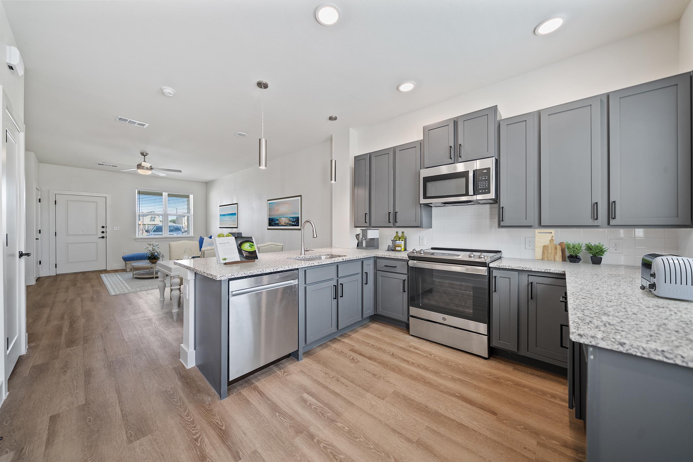 a kitchen with a wooden floor