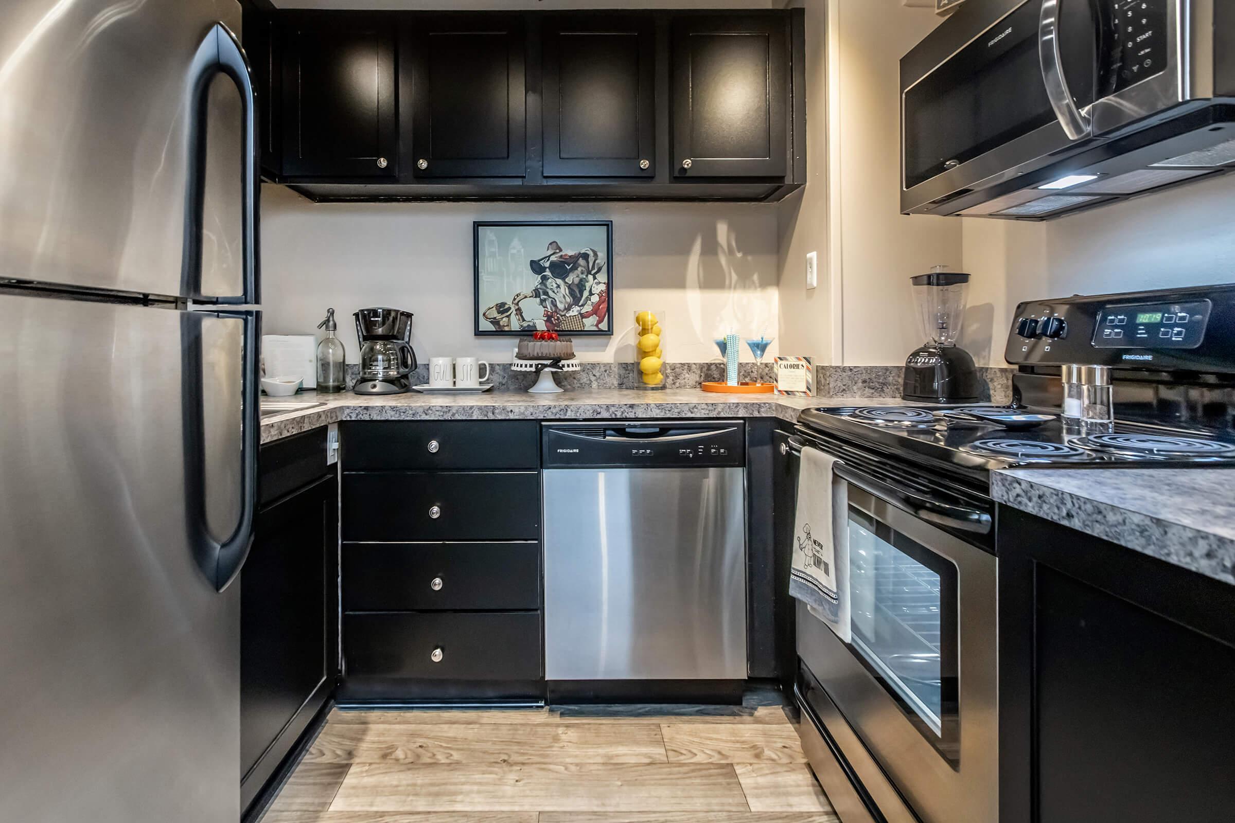 a large kitchen with stainless steel appliances