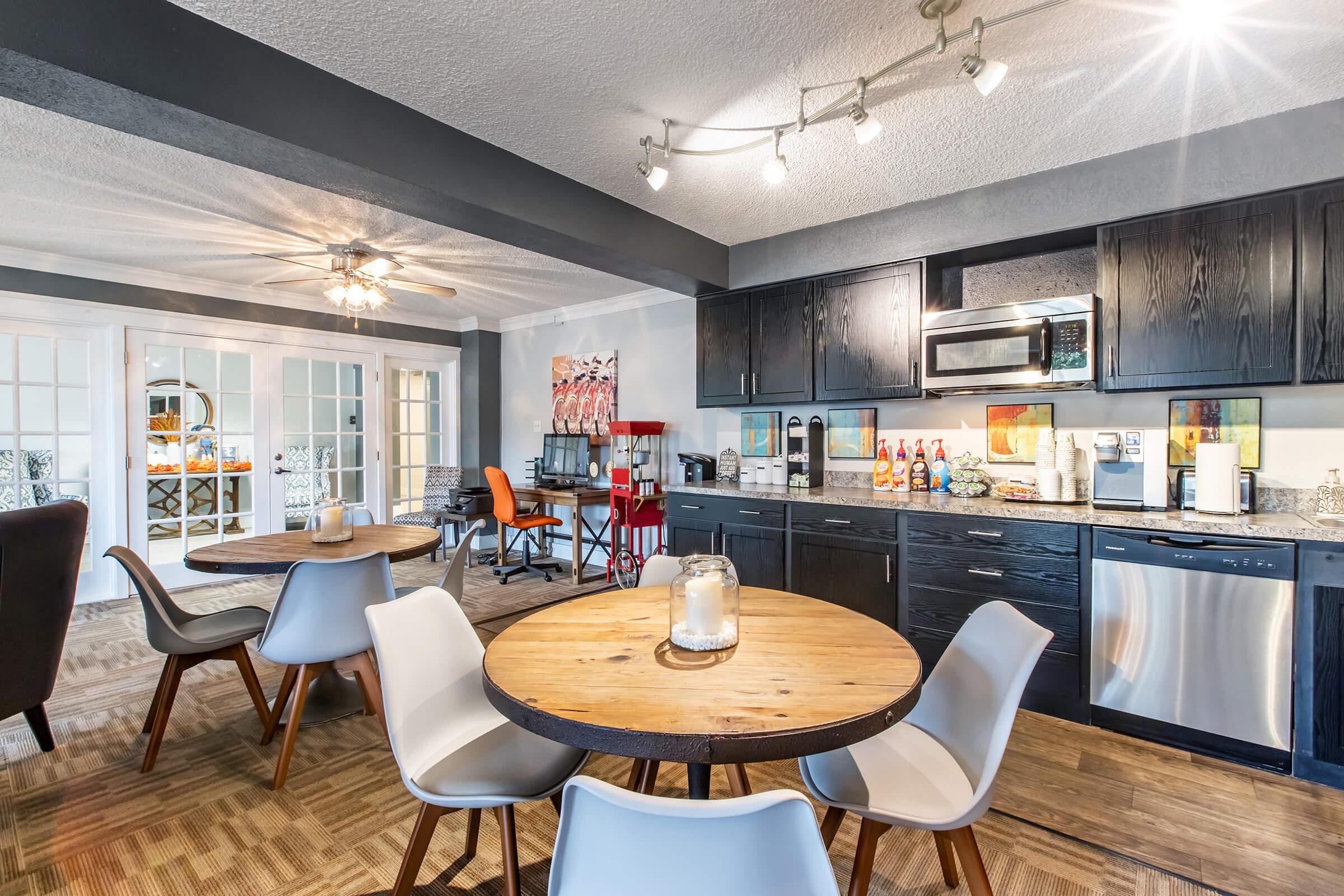 a kitchen with a dining room table