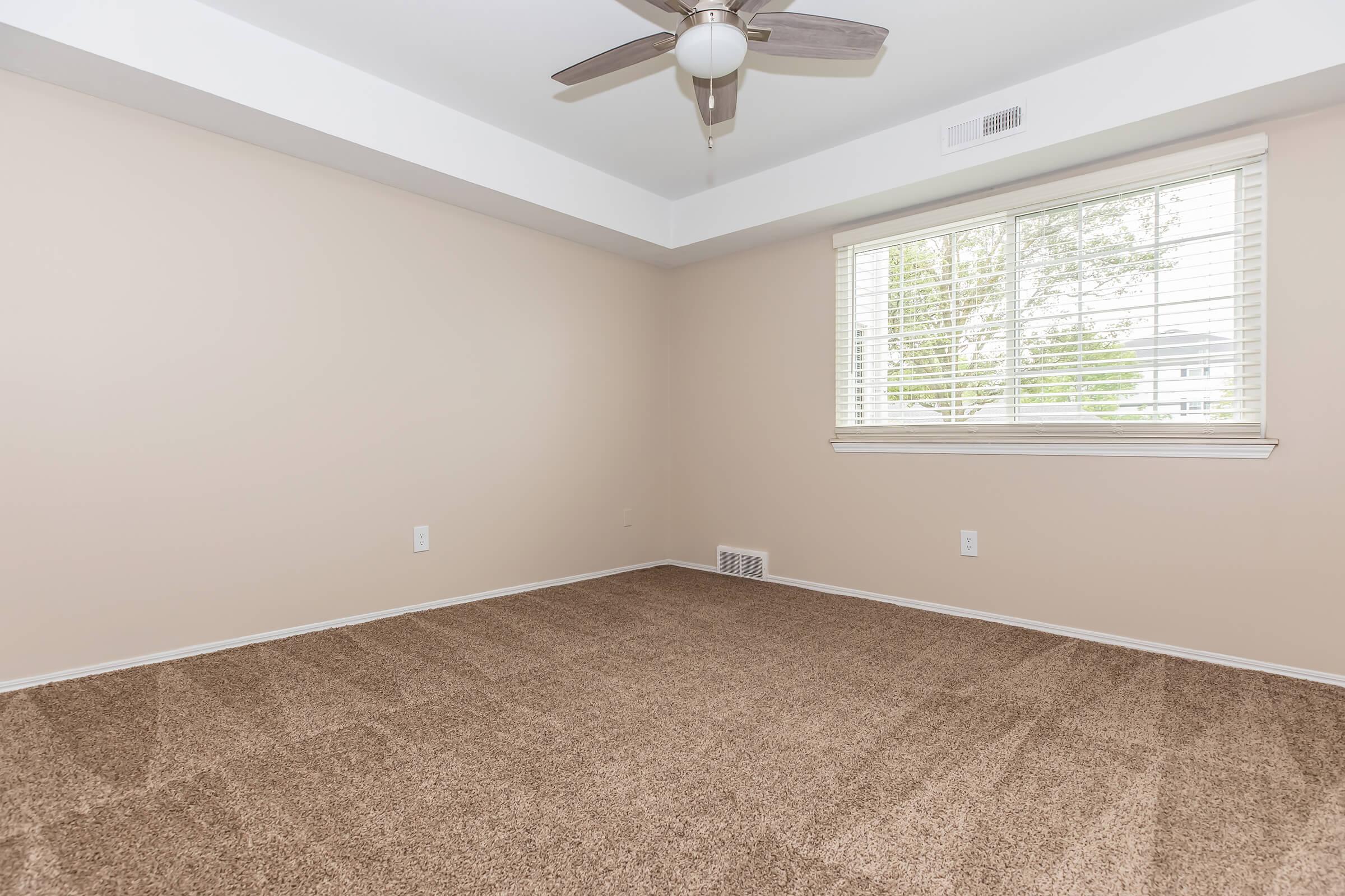 a bedroom with a large window