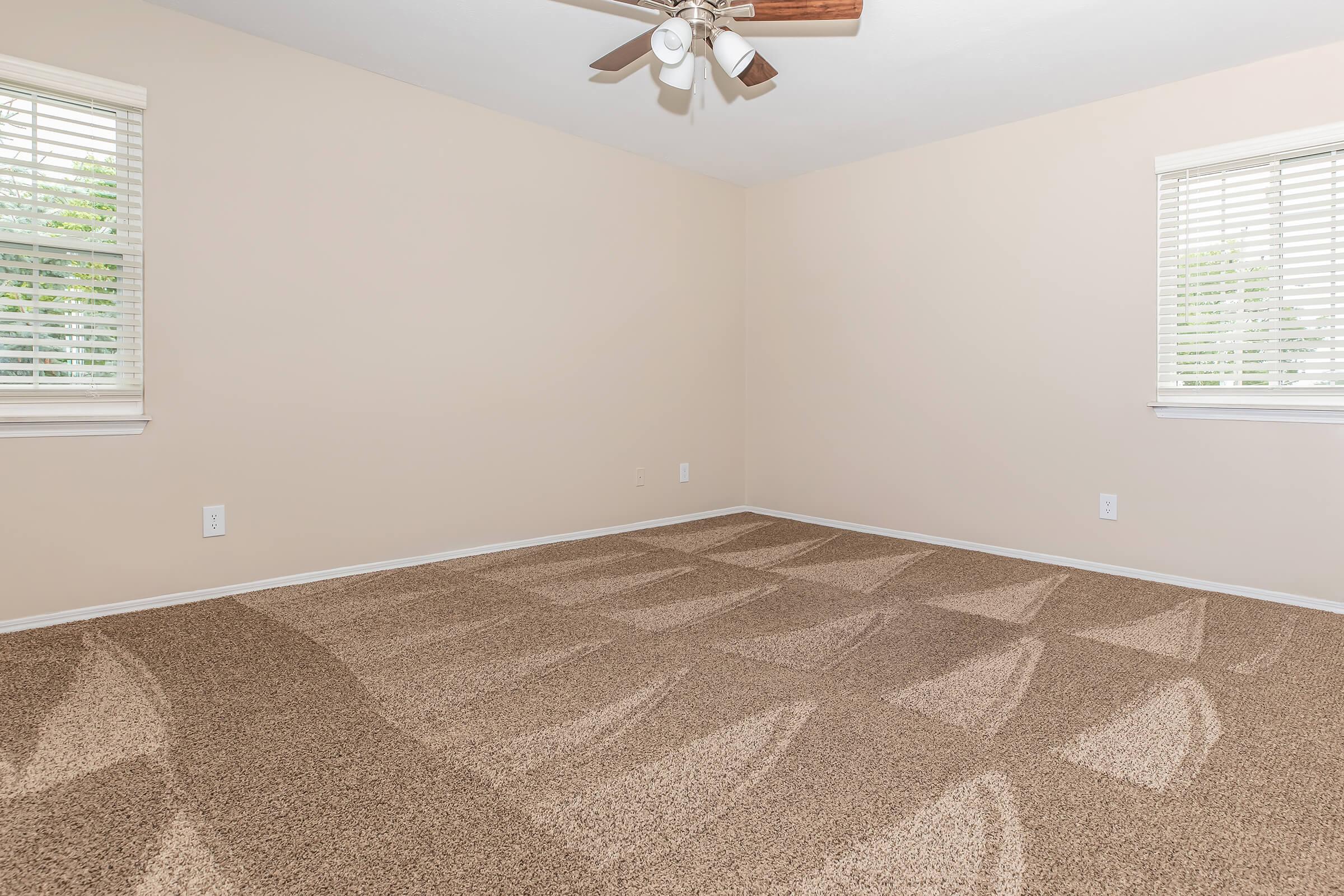 a bedroom with a large window