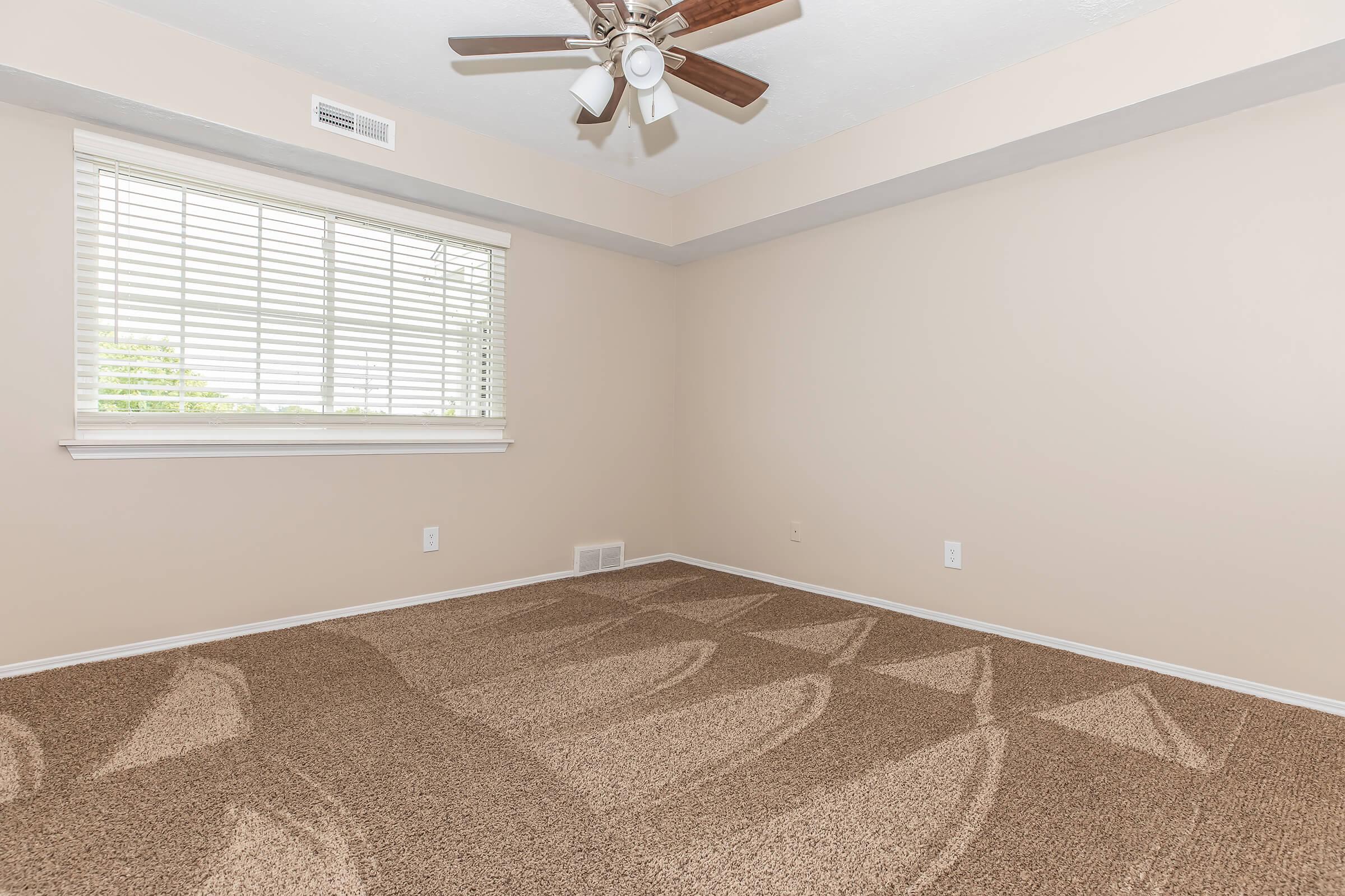 a bedroom with a large window