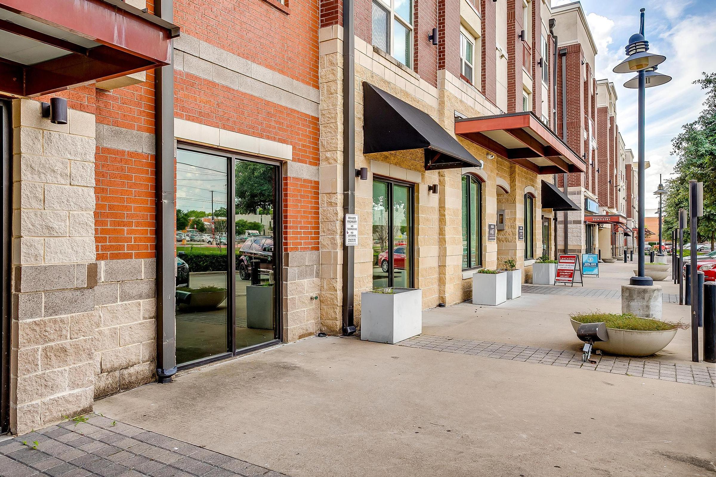 a close up of a street in front of a brick building