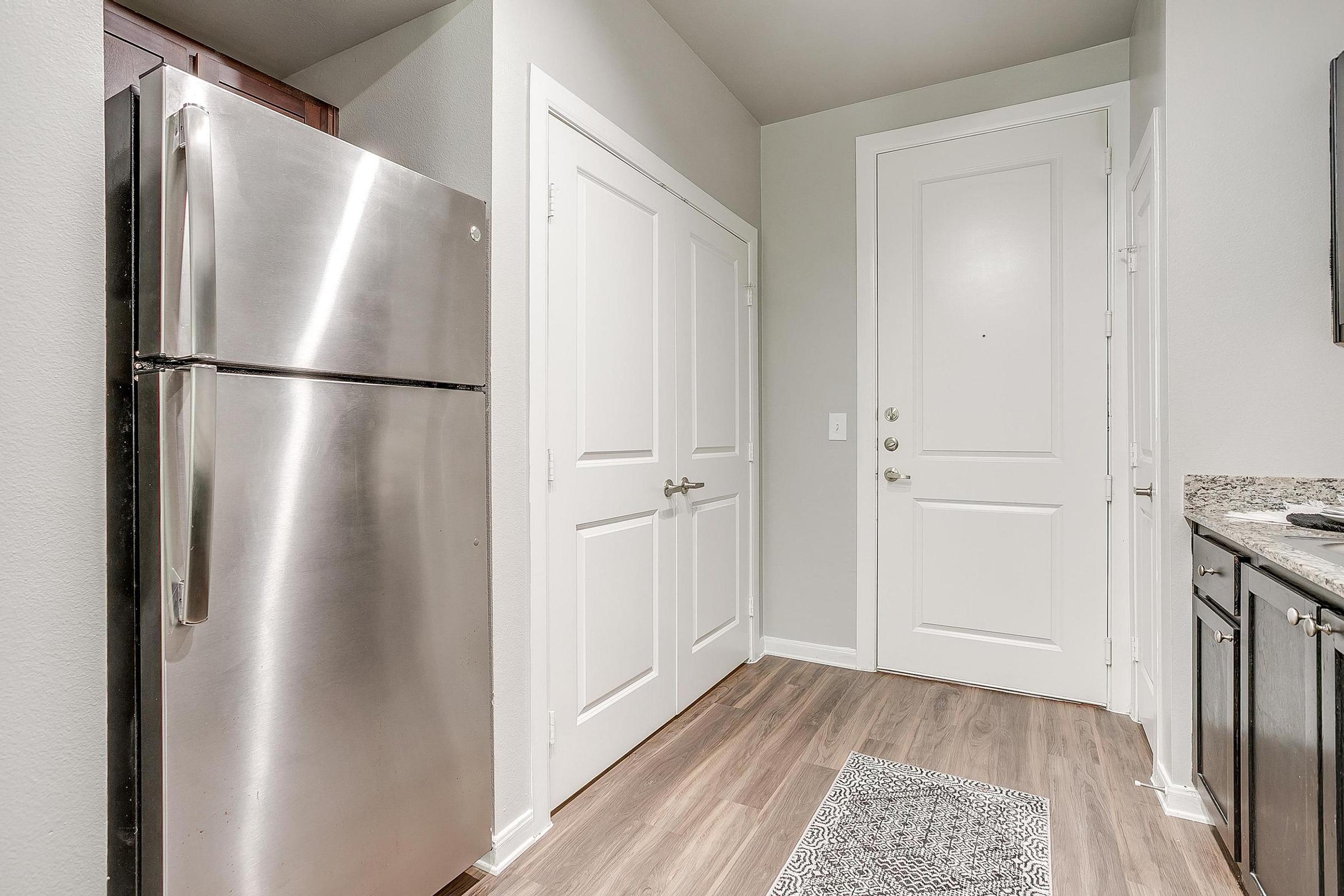 a stainless steel refrigerator in a kitchen