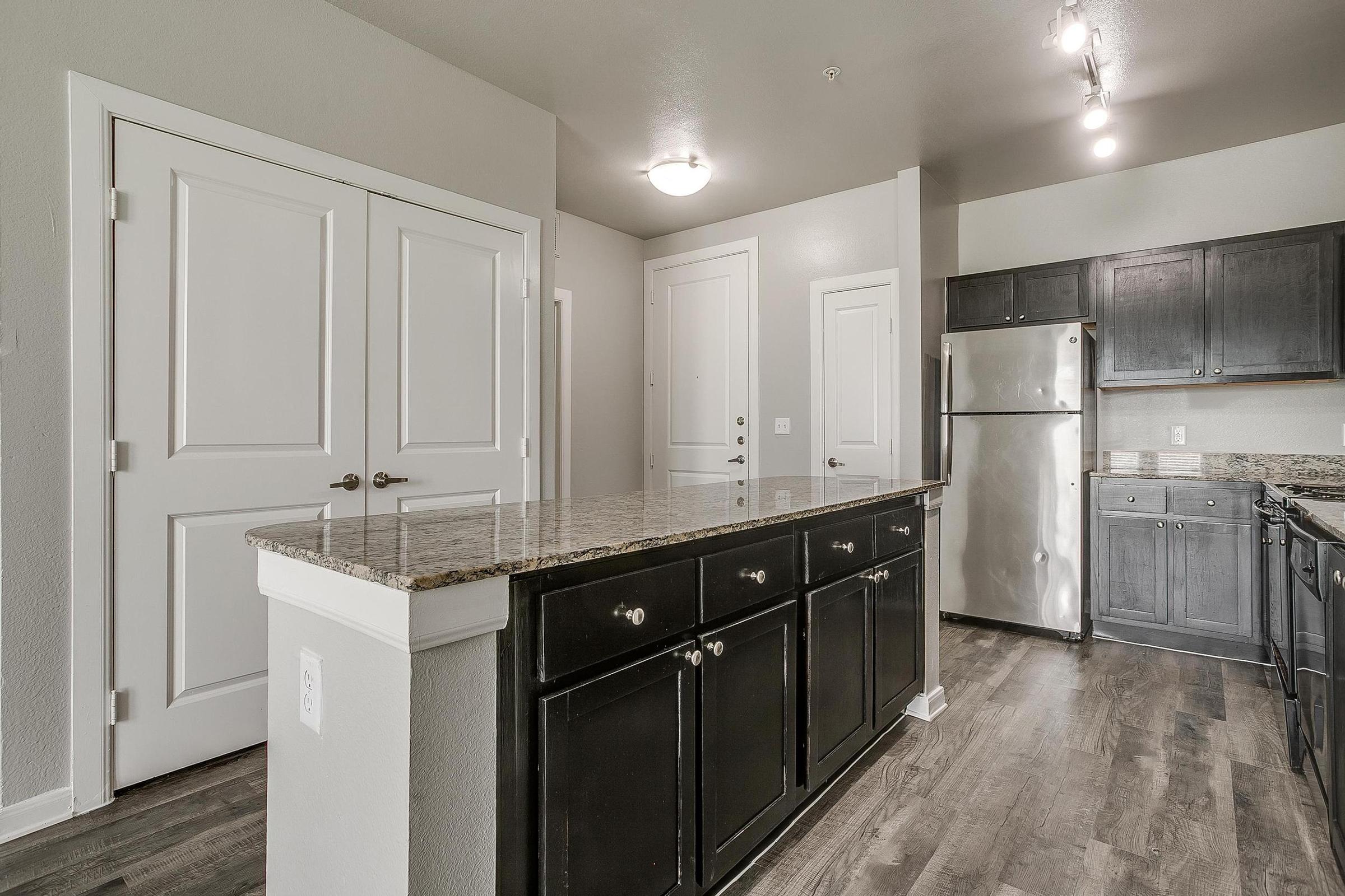 a kitchen filled with appliances and cabinets