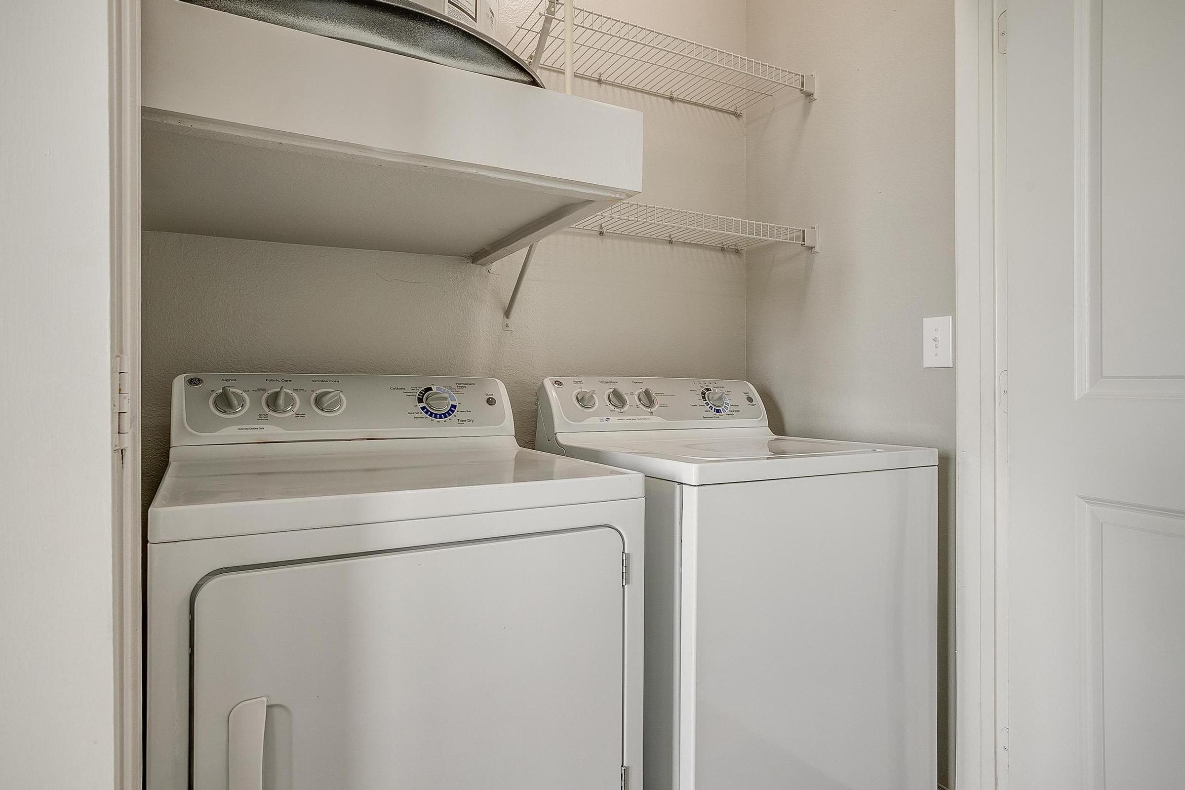 a kitchen with a sink and a refrigerator