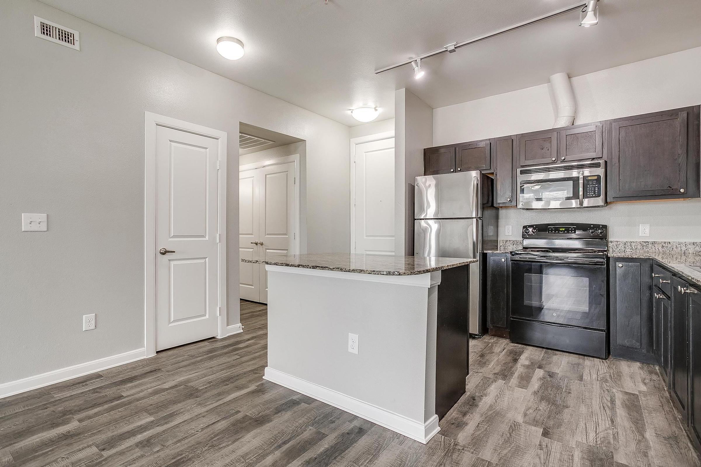 a room filled with furniture and a refrigerator