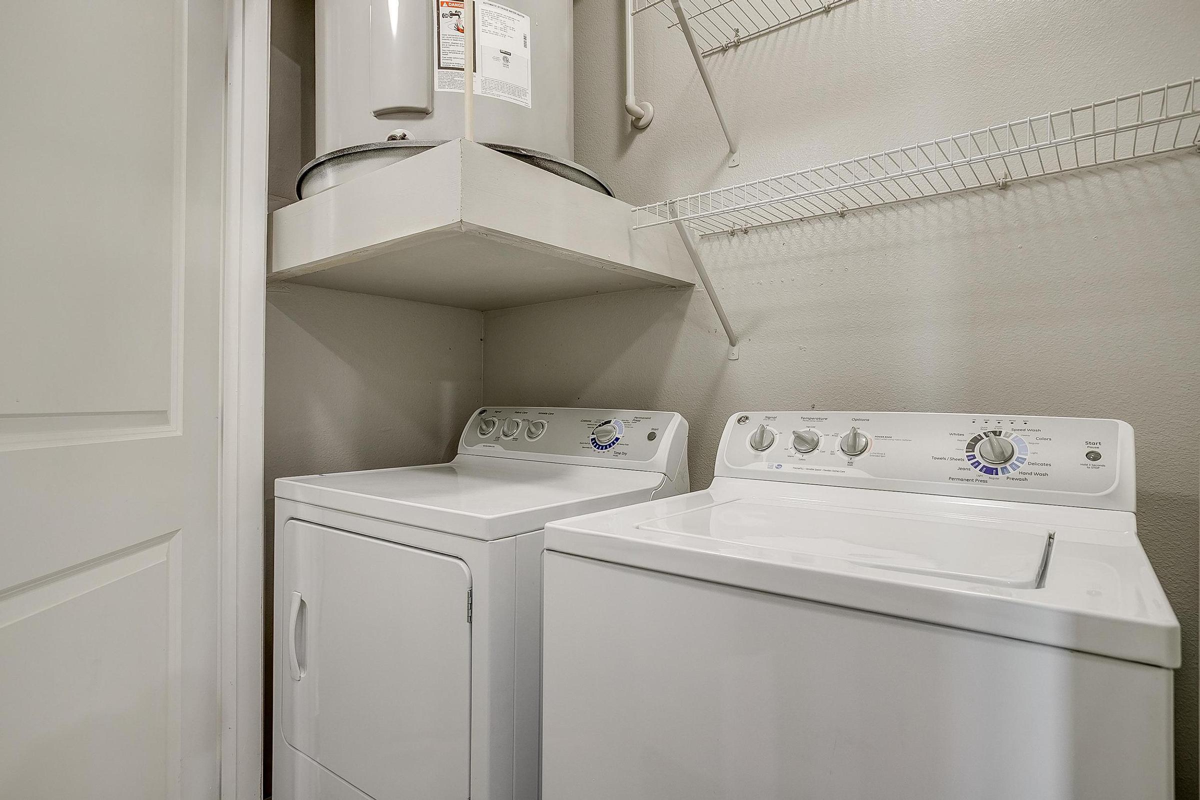 a kitchen with a sink and a refrigerator