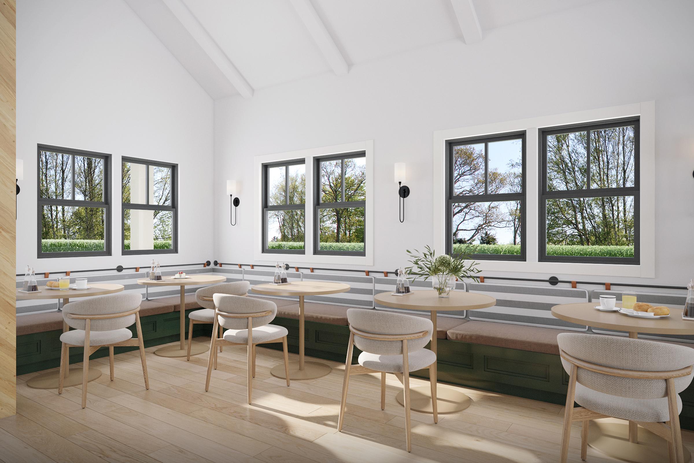 a living room filled with furniture and a large window