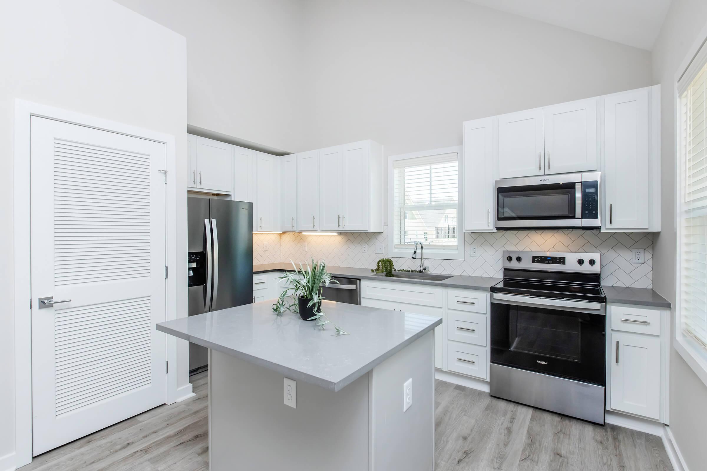 a kitchen with a sink and a microwave