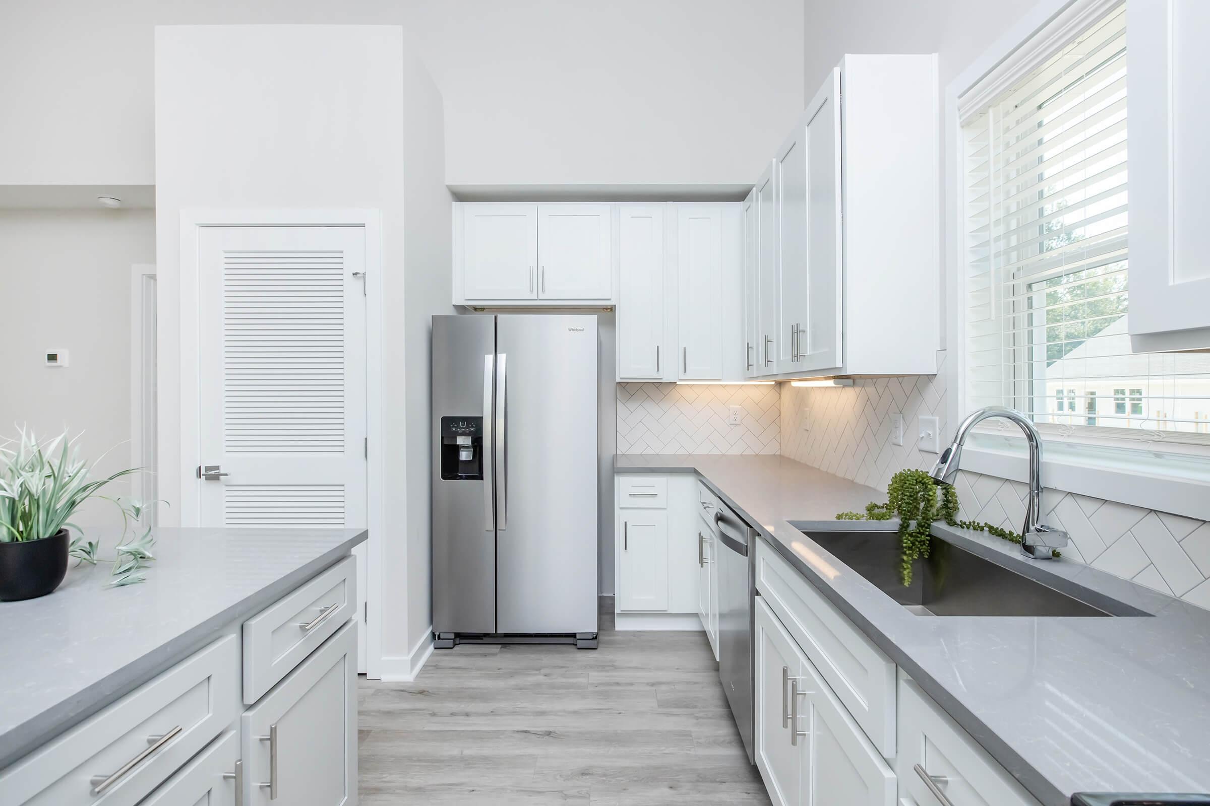 a kitchen with a sink and a window