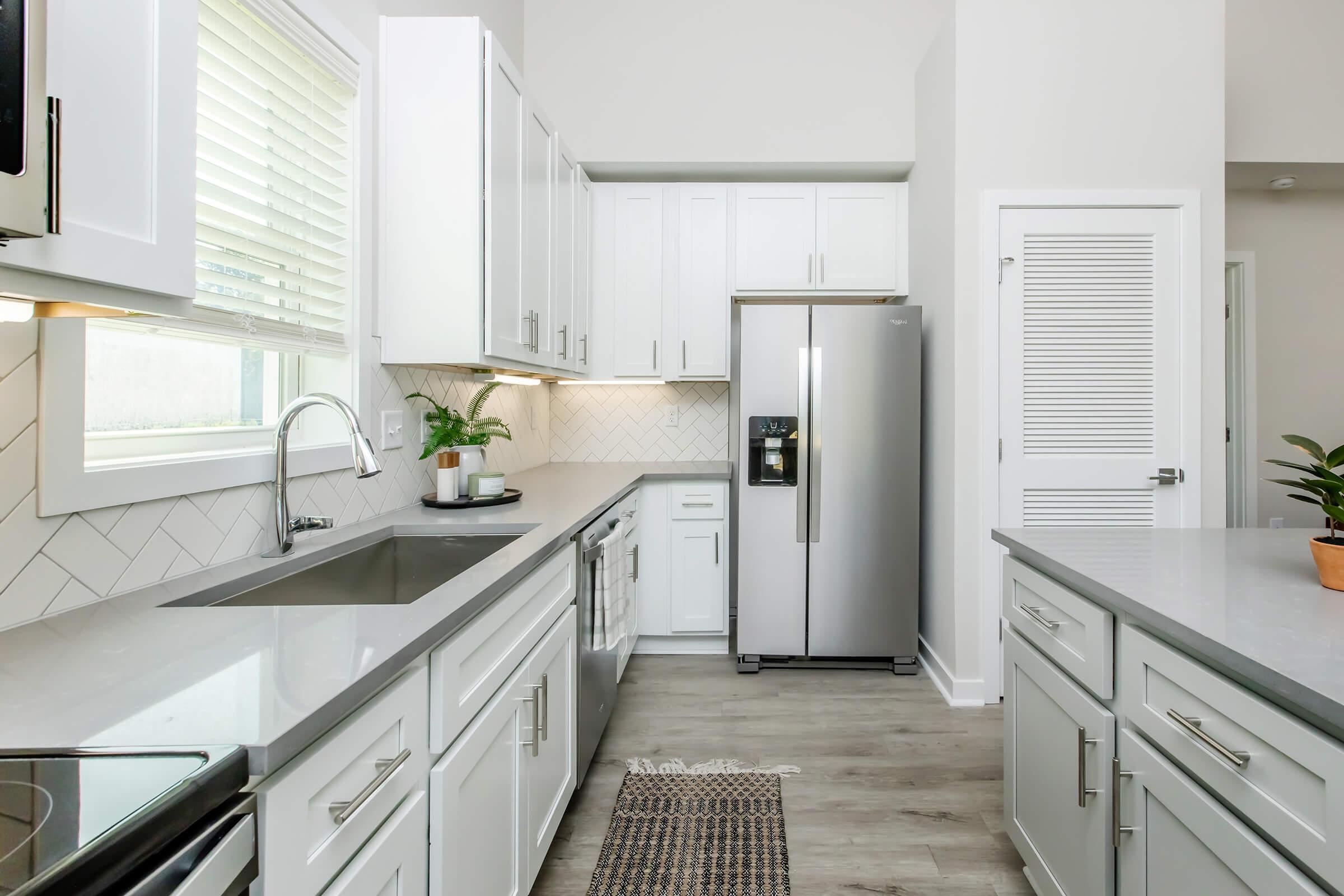 a kitchen with a sink and a window