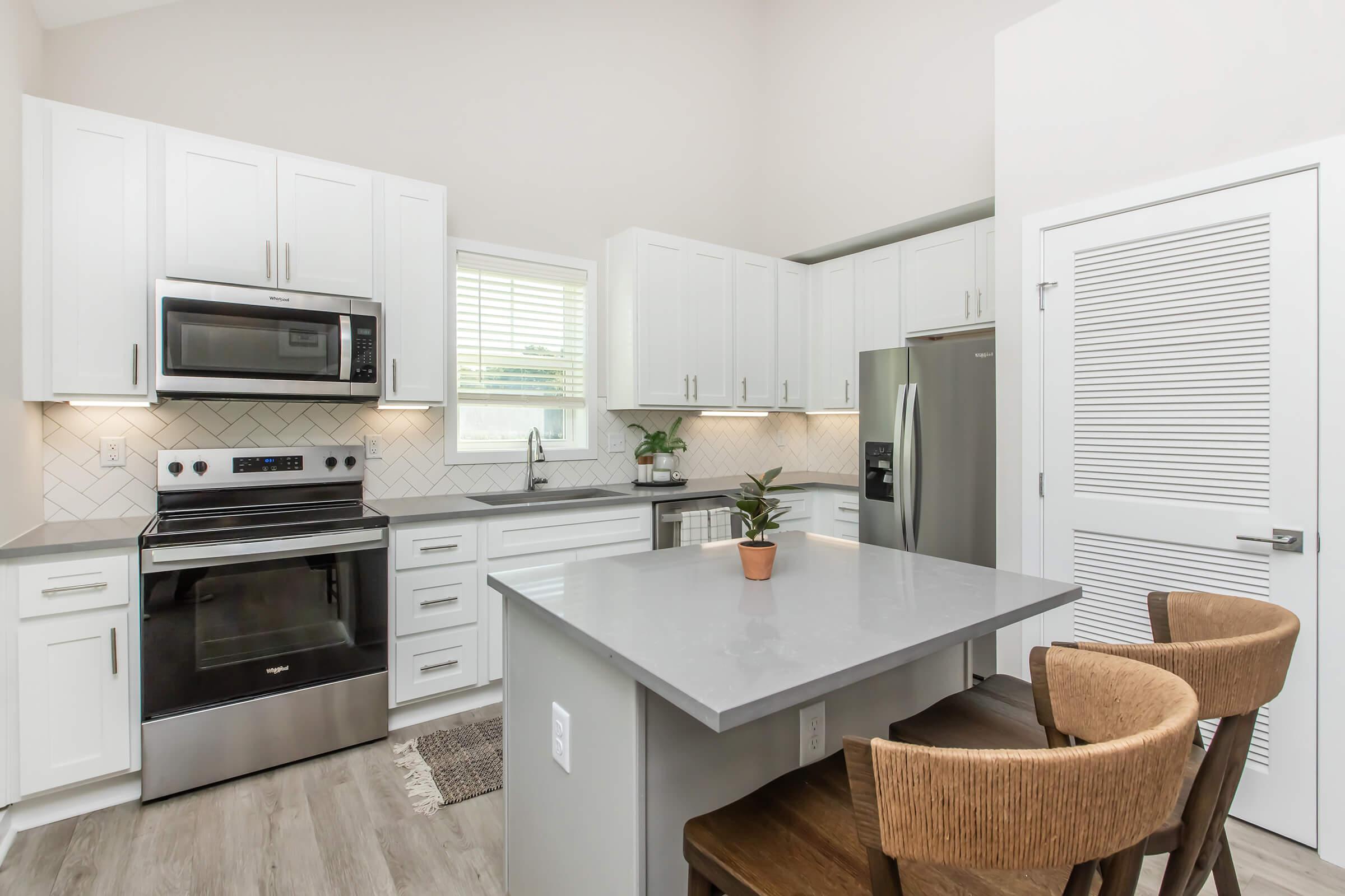 a kitchen with a sink and a microwave