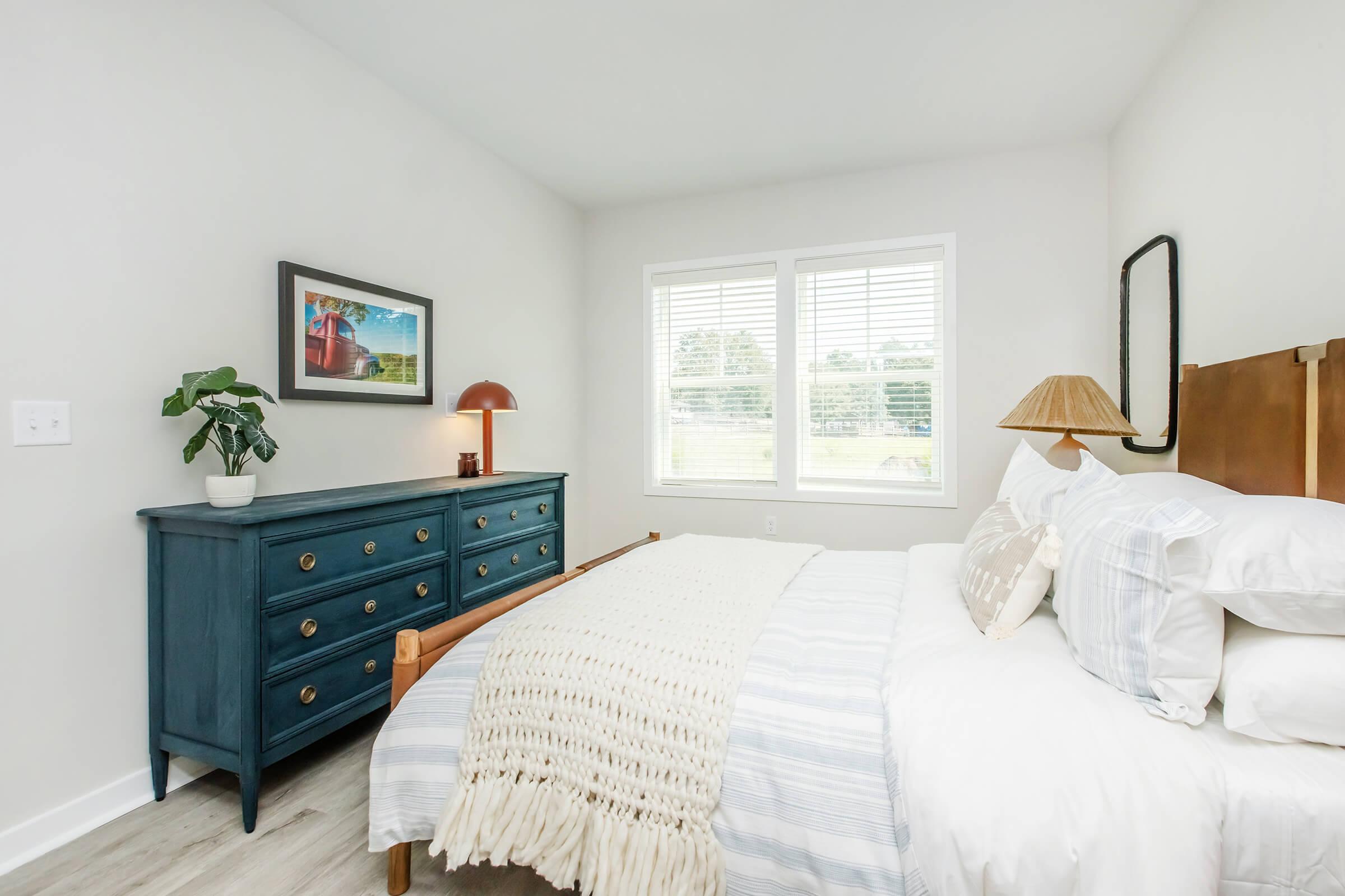 a bedroom with a large bed in a room