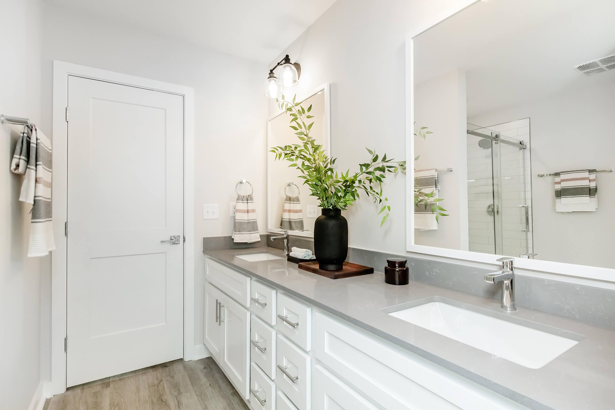 a kitchen with a sink and a mirror