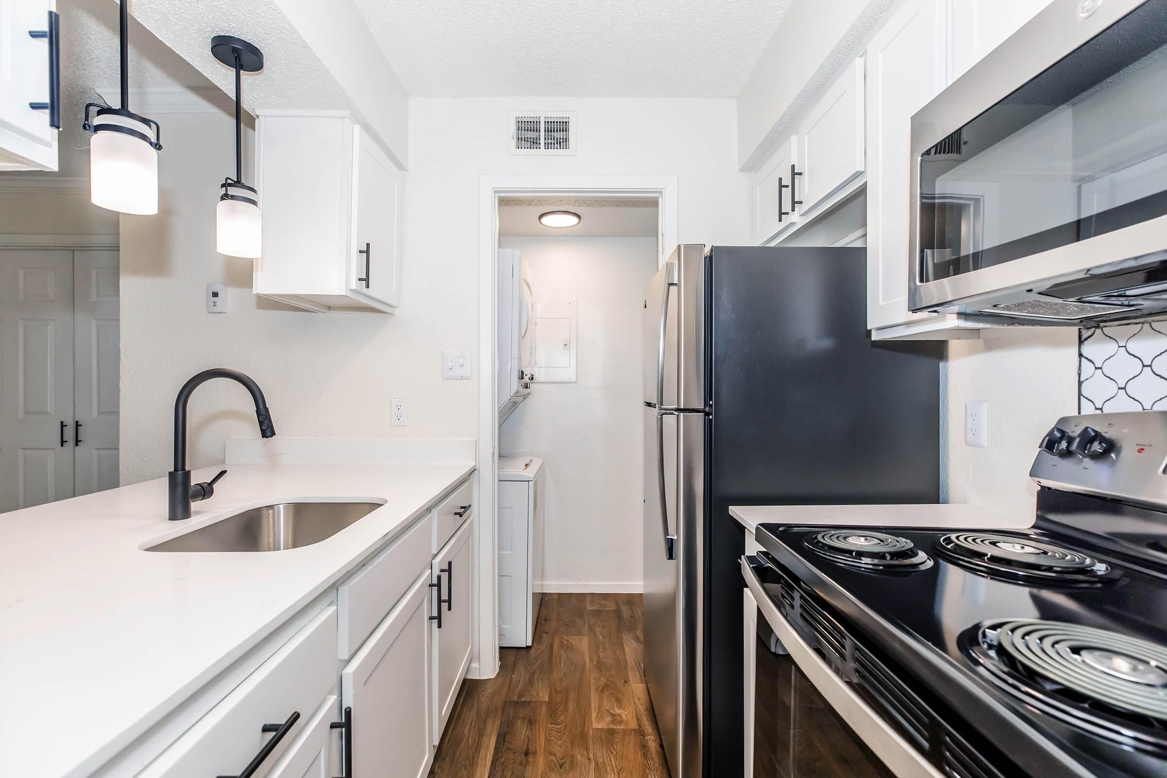 a large kitchen with stainless steel appliances