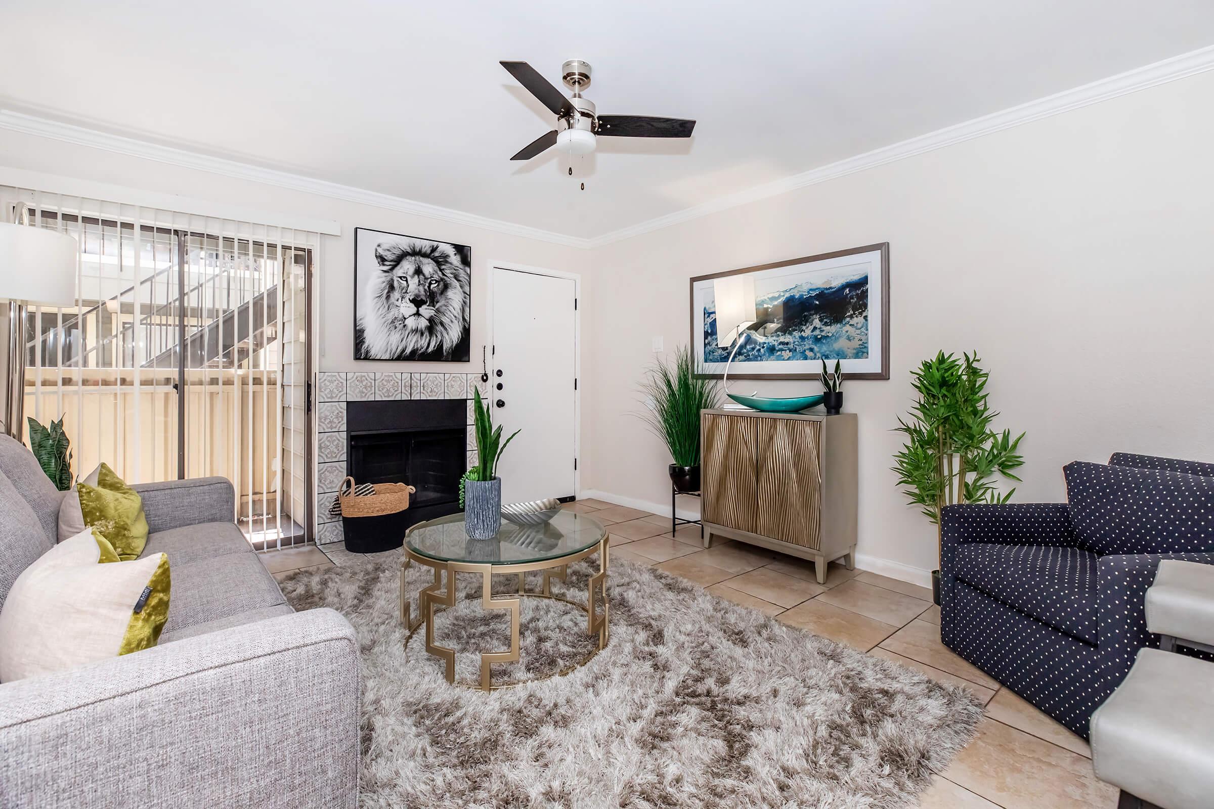 a living room filled with furniture and a rug