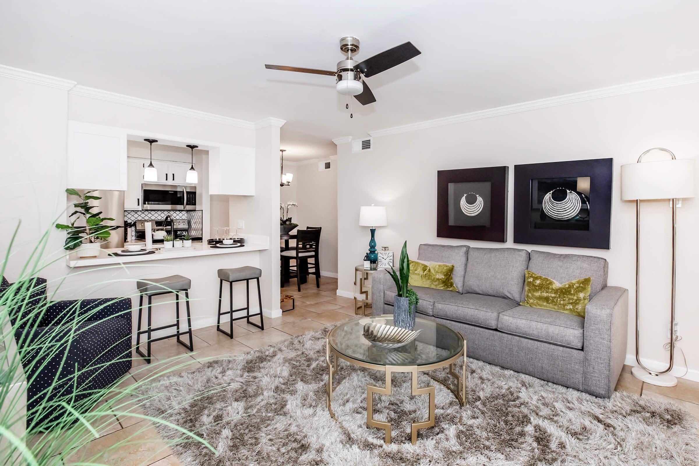 a living room filled with furniture and a fireplace