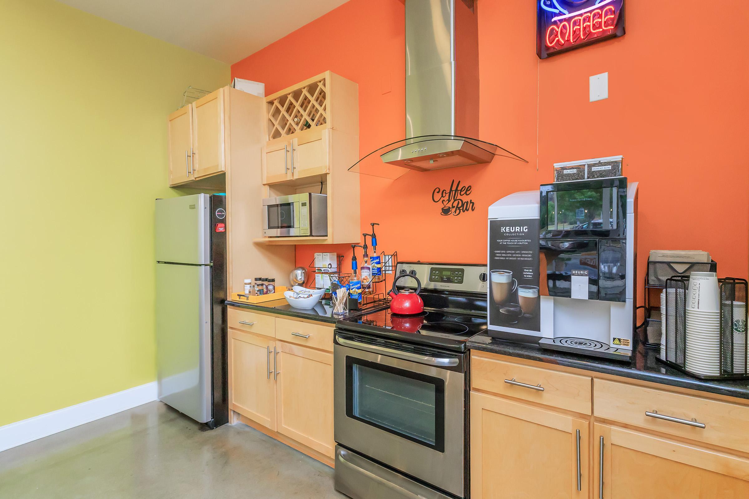 a kitchen with a stove and a microwave