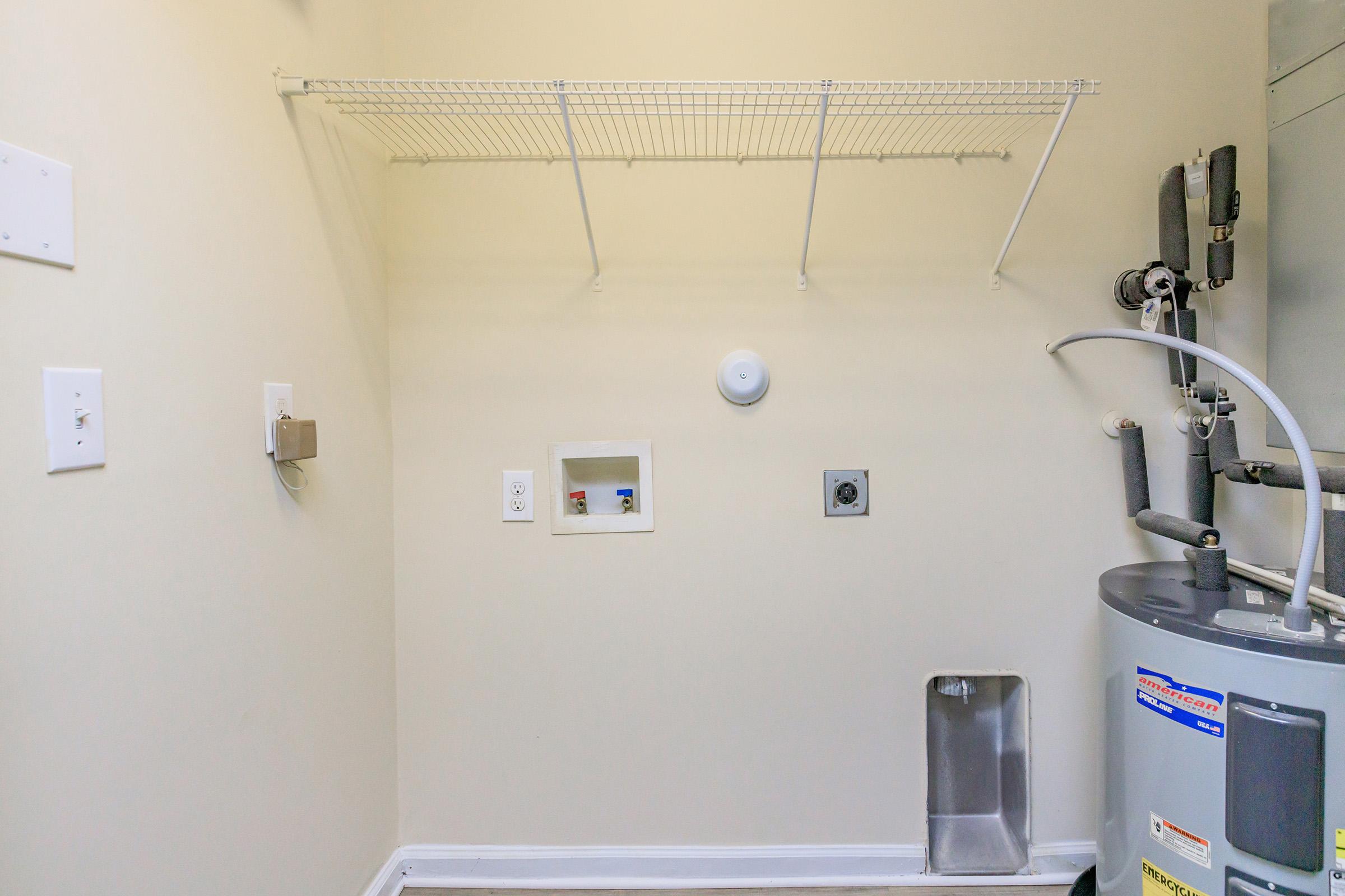 a kitchen with a sink and a mirror