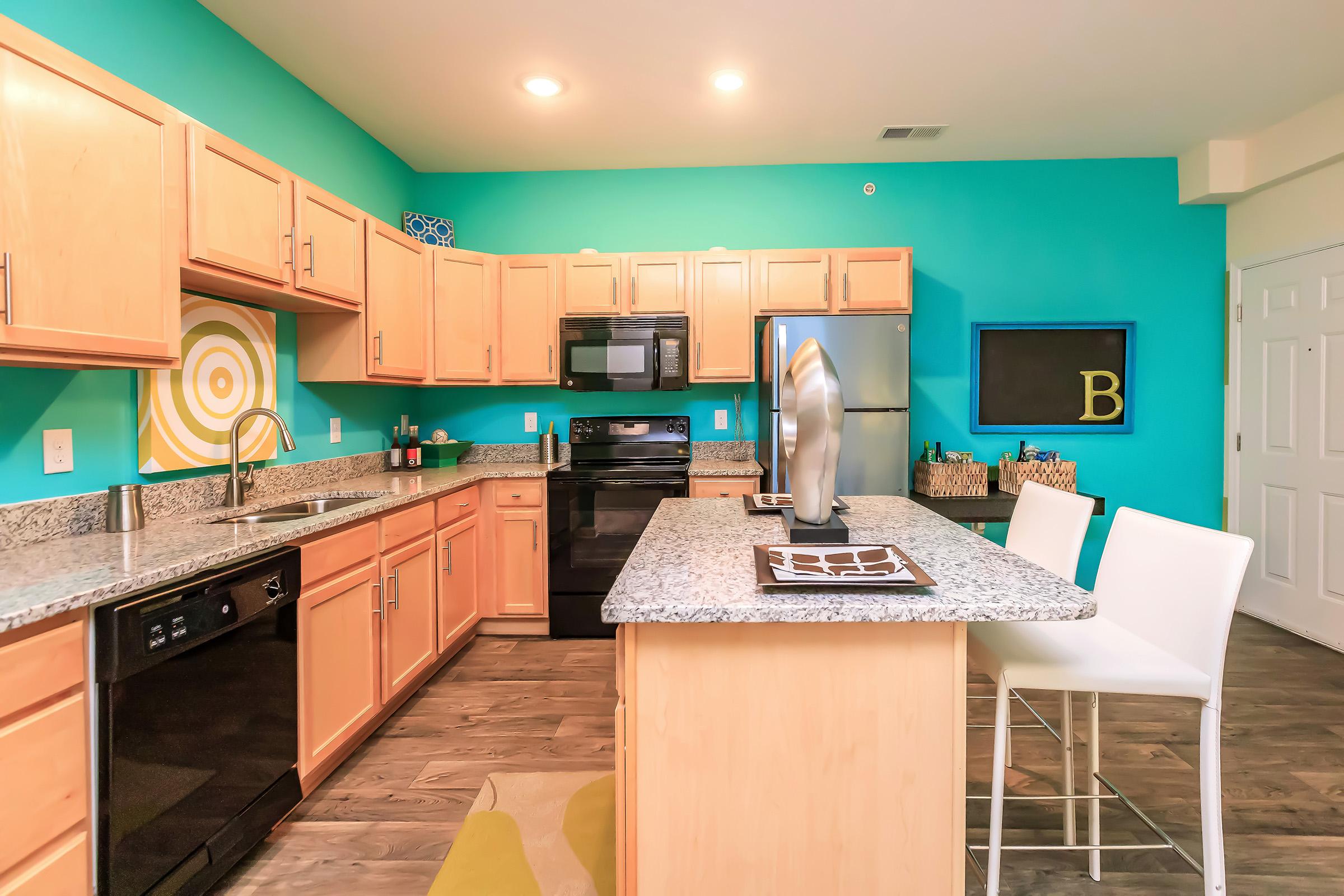 a kitchen with an island in the middle of a room