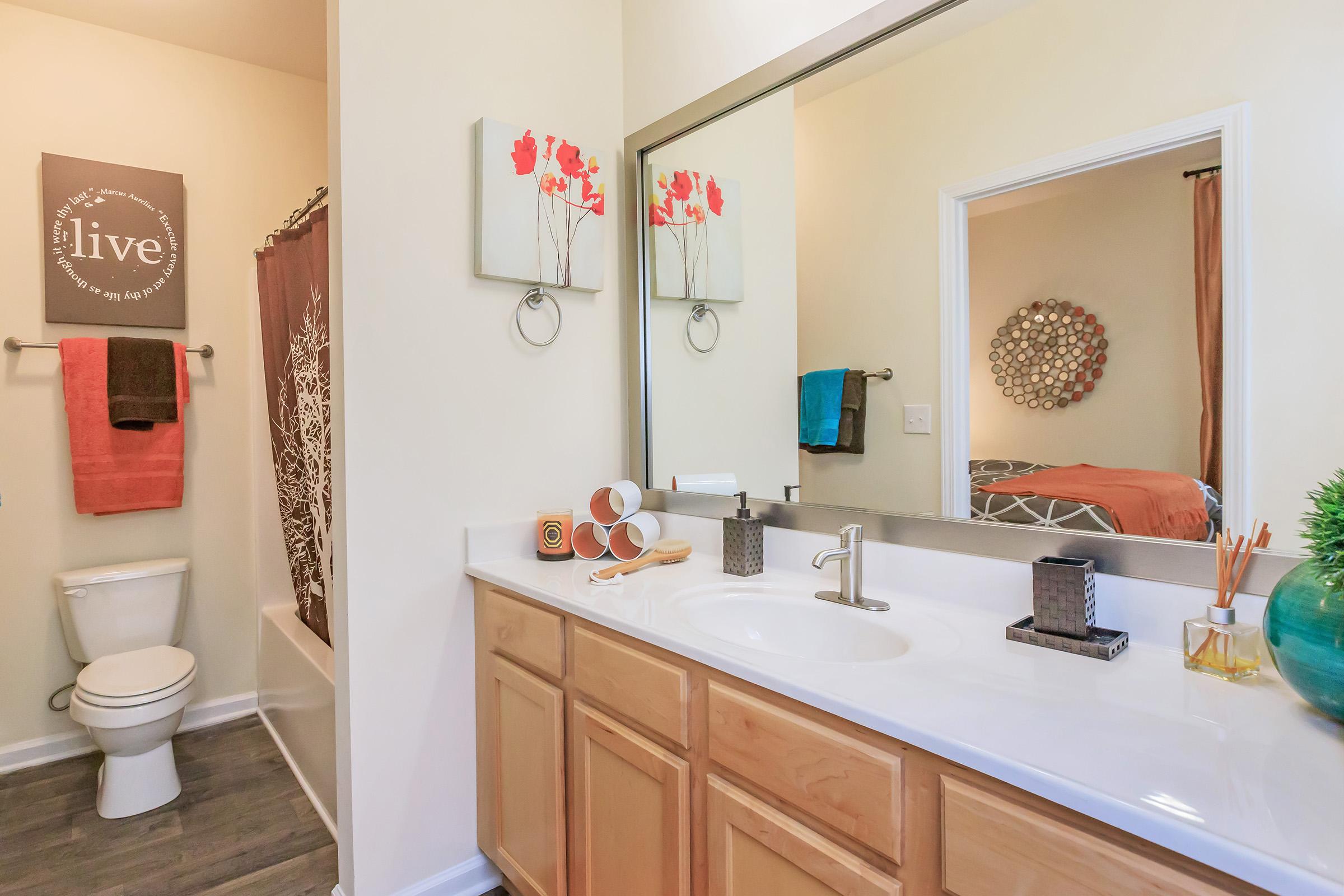 a kitchen with a sink and a mirror