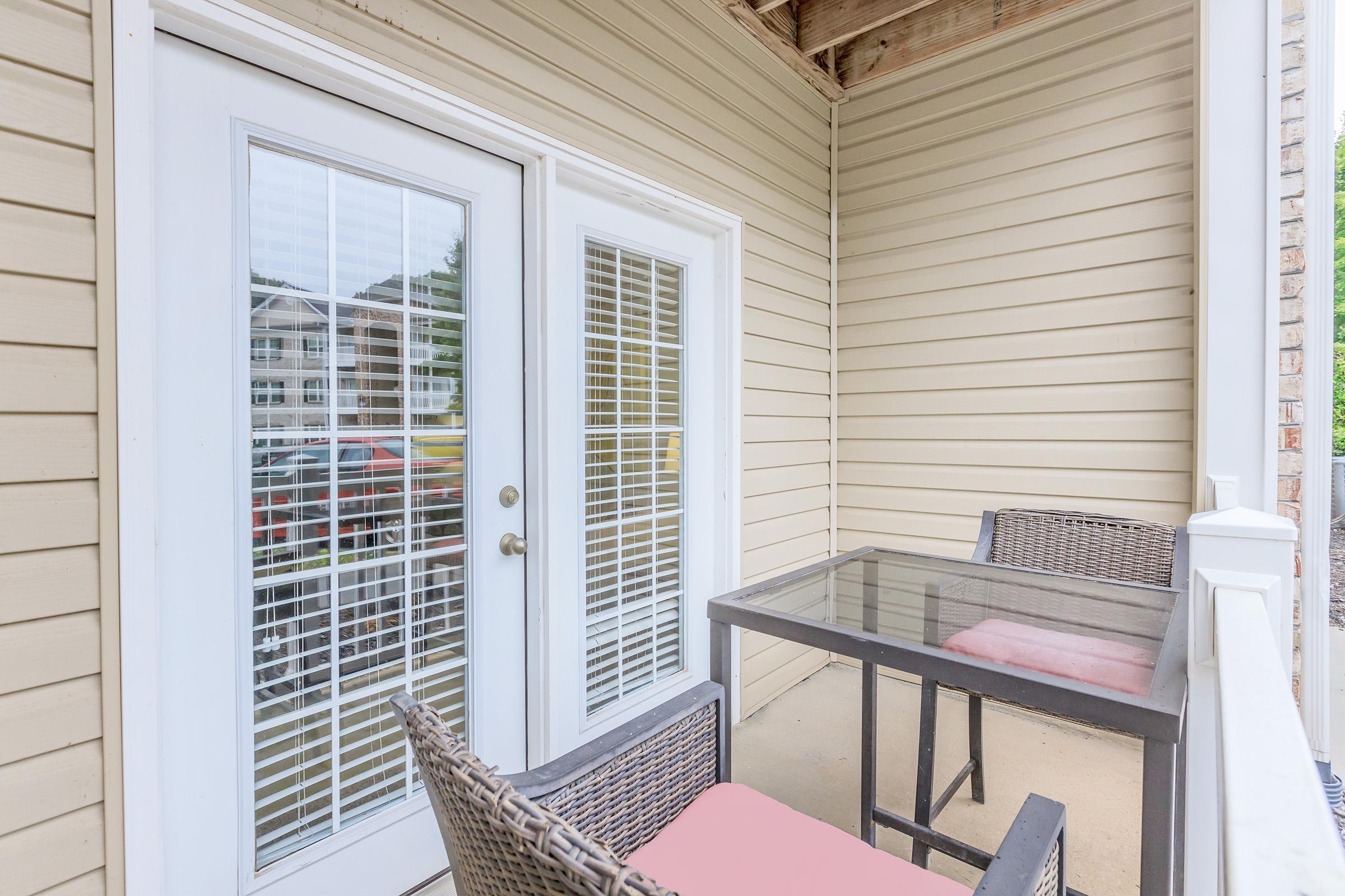 a chair sitting in front of a window