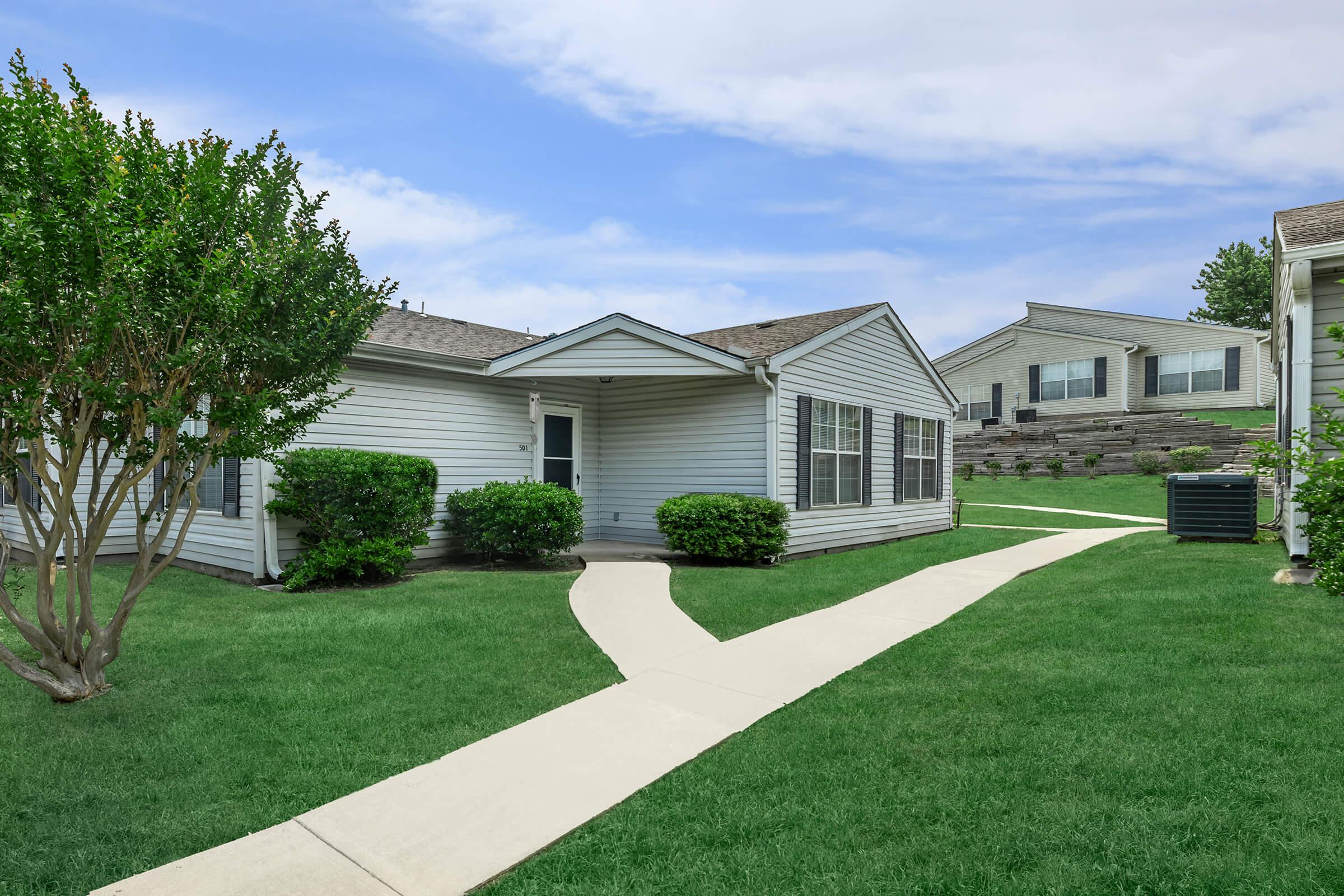 a large lawn in front of a house