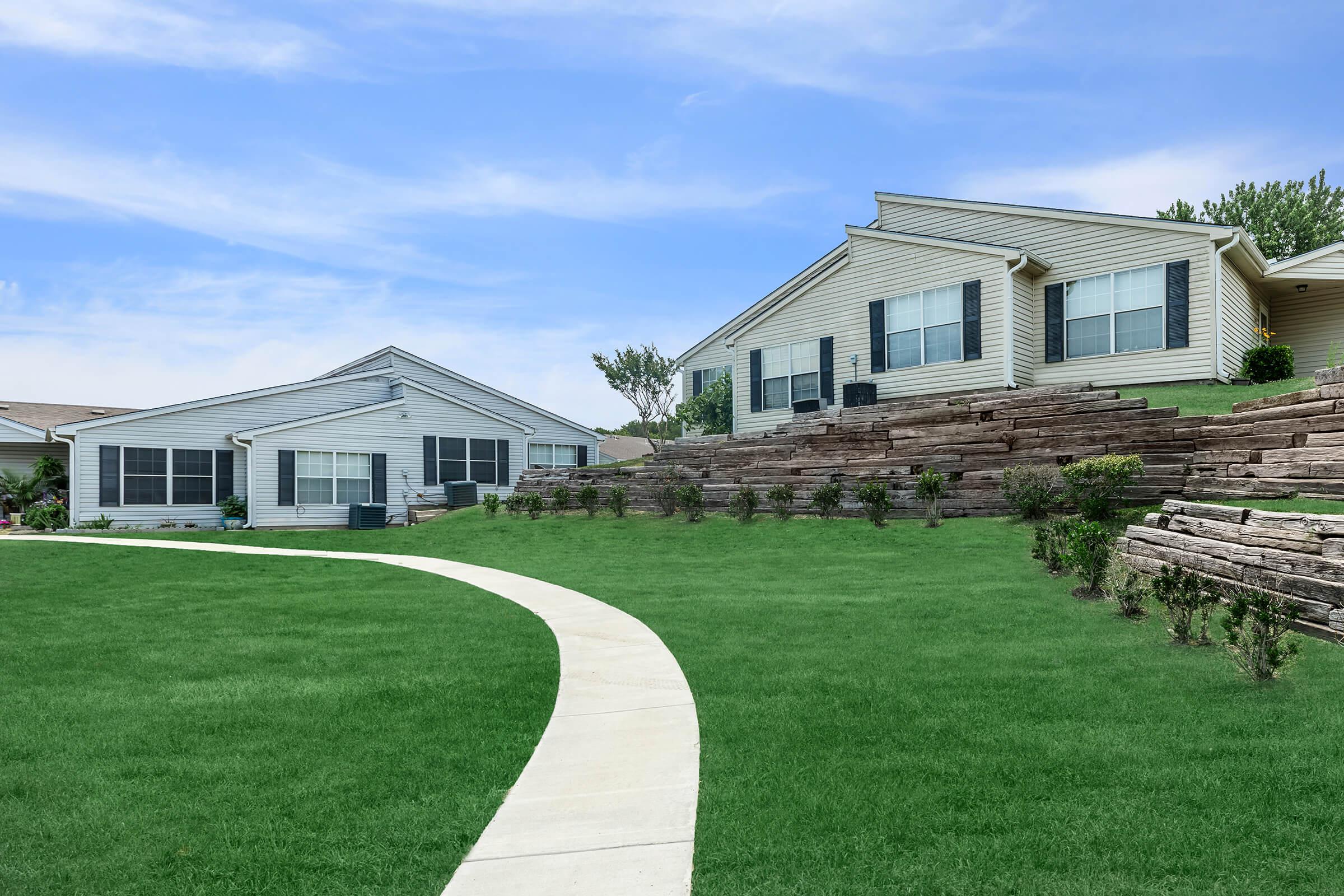 a large lawn in front of a house