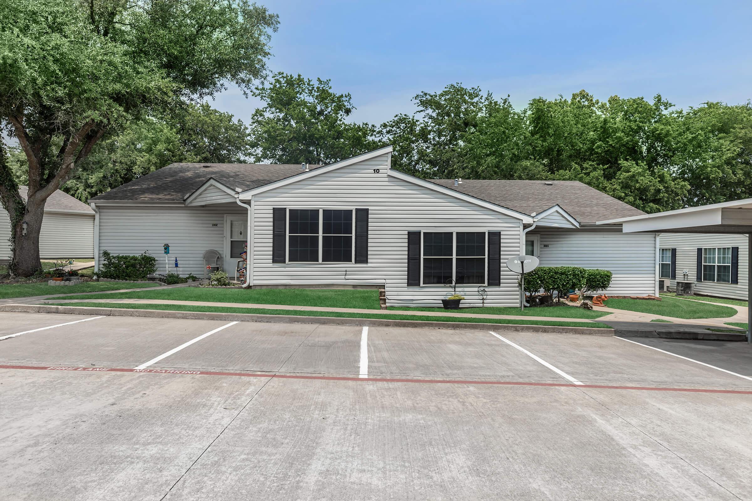 a small house in a parking lot