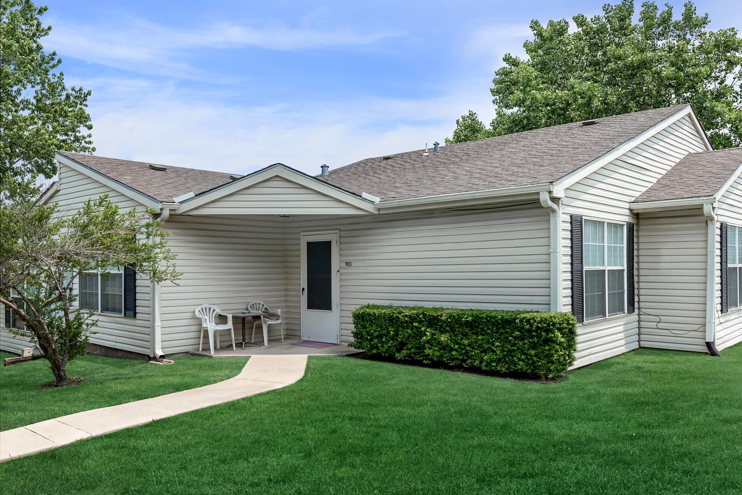 a large lawn in front of a house