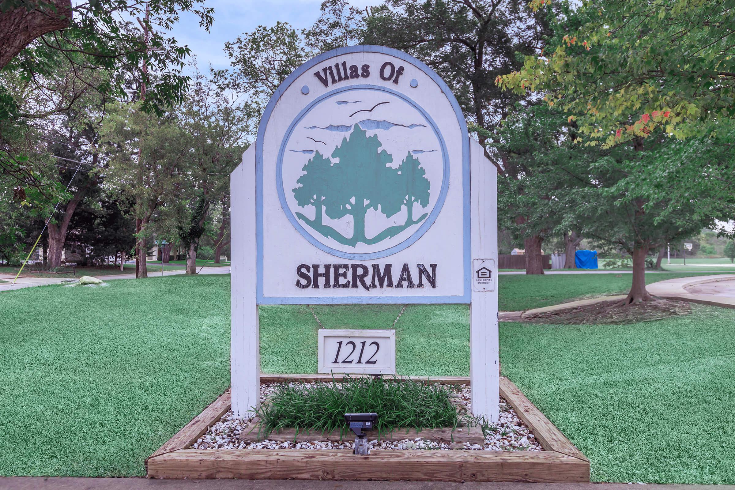 a sign in the middle of a park