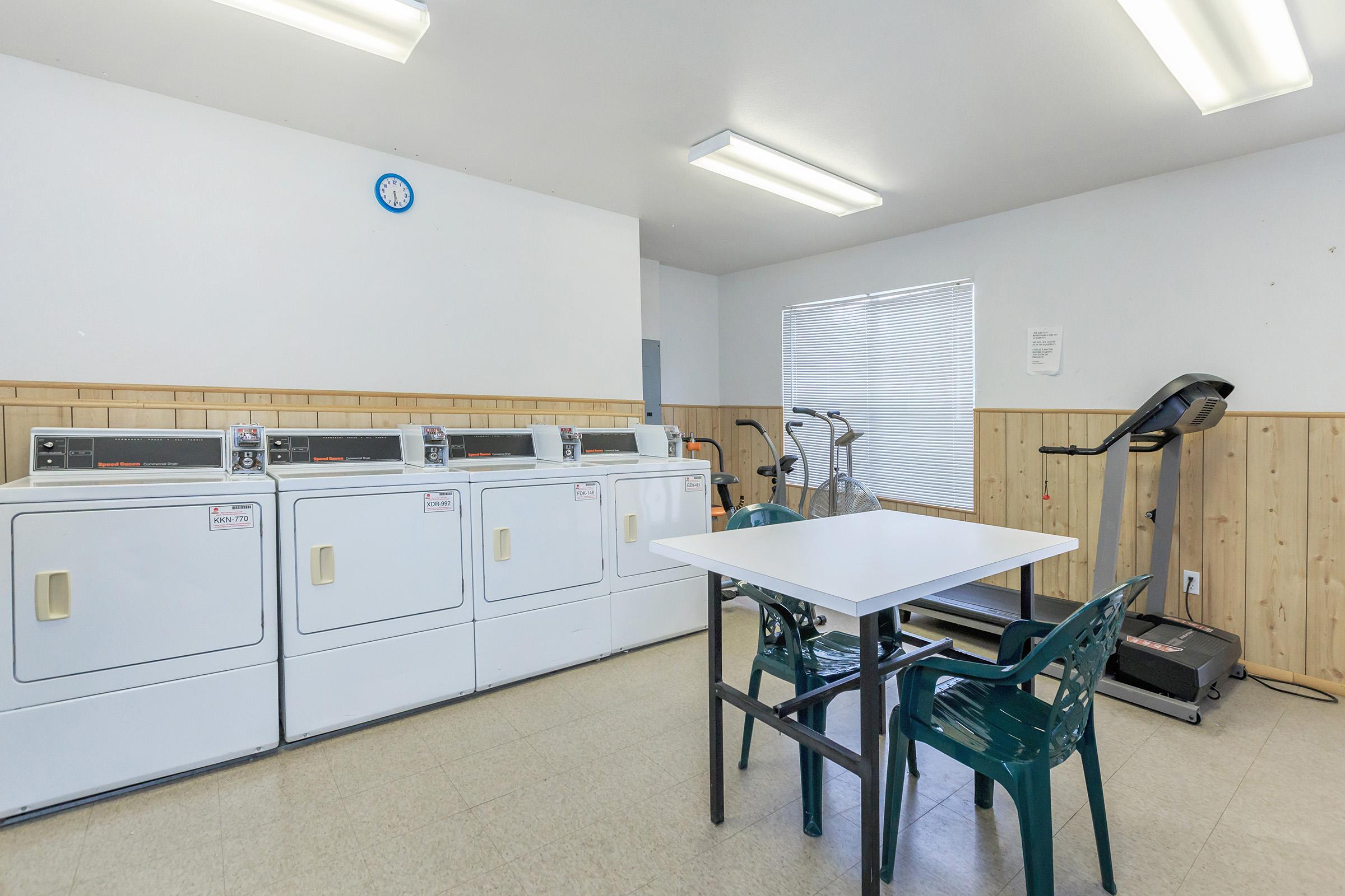 a white refrigerator freezer sitting inside of a kitchen