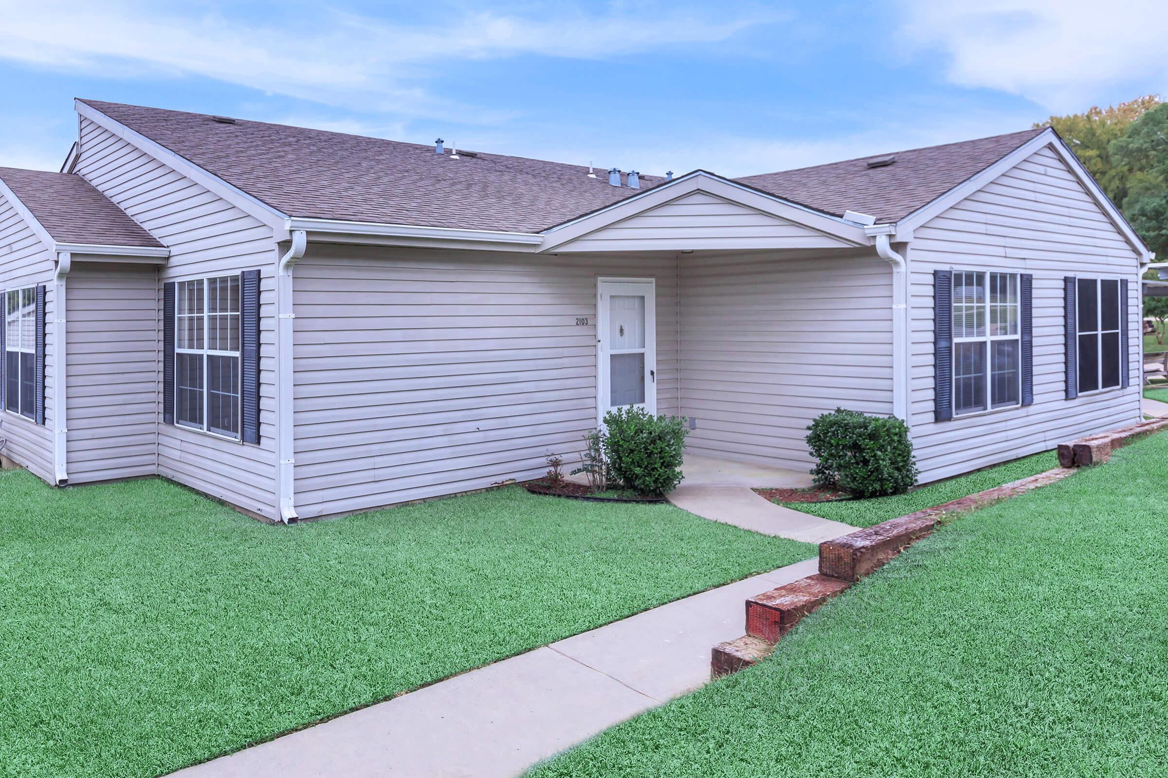 a large lawn in front of a house