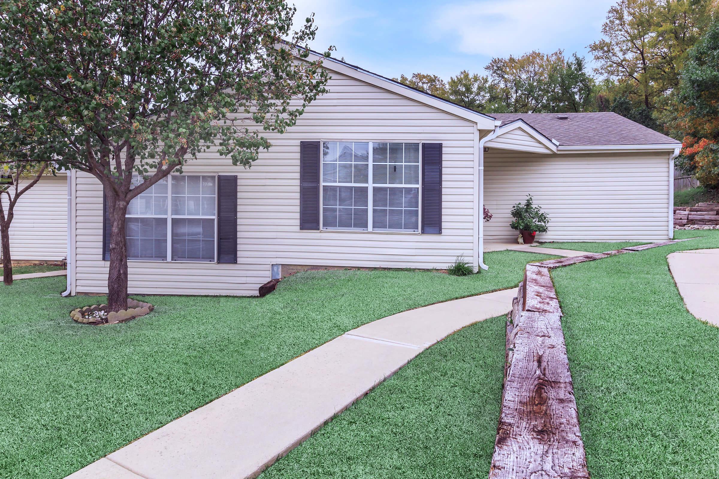 a large lawn in front of a house