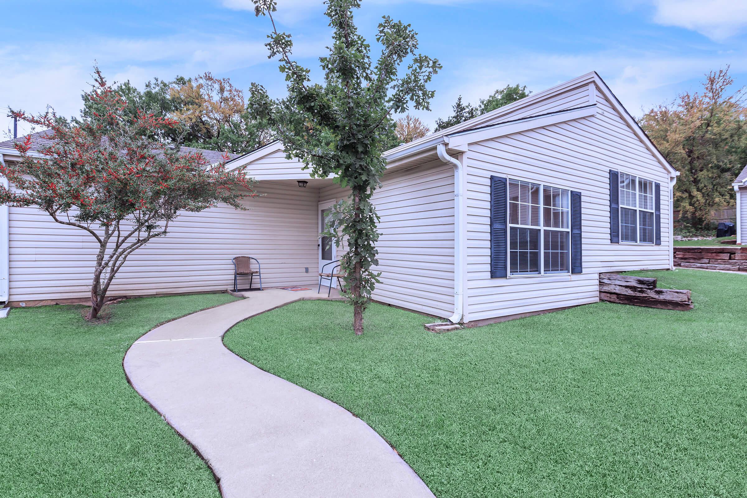 a large lawn in front of a house