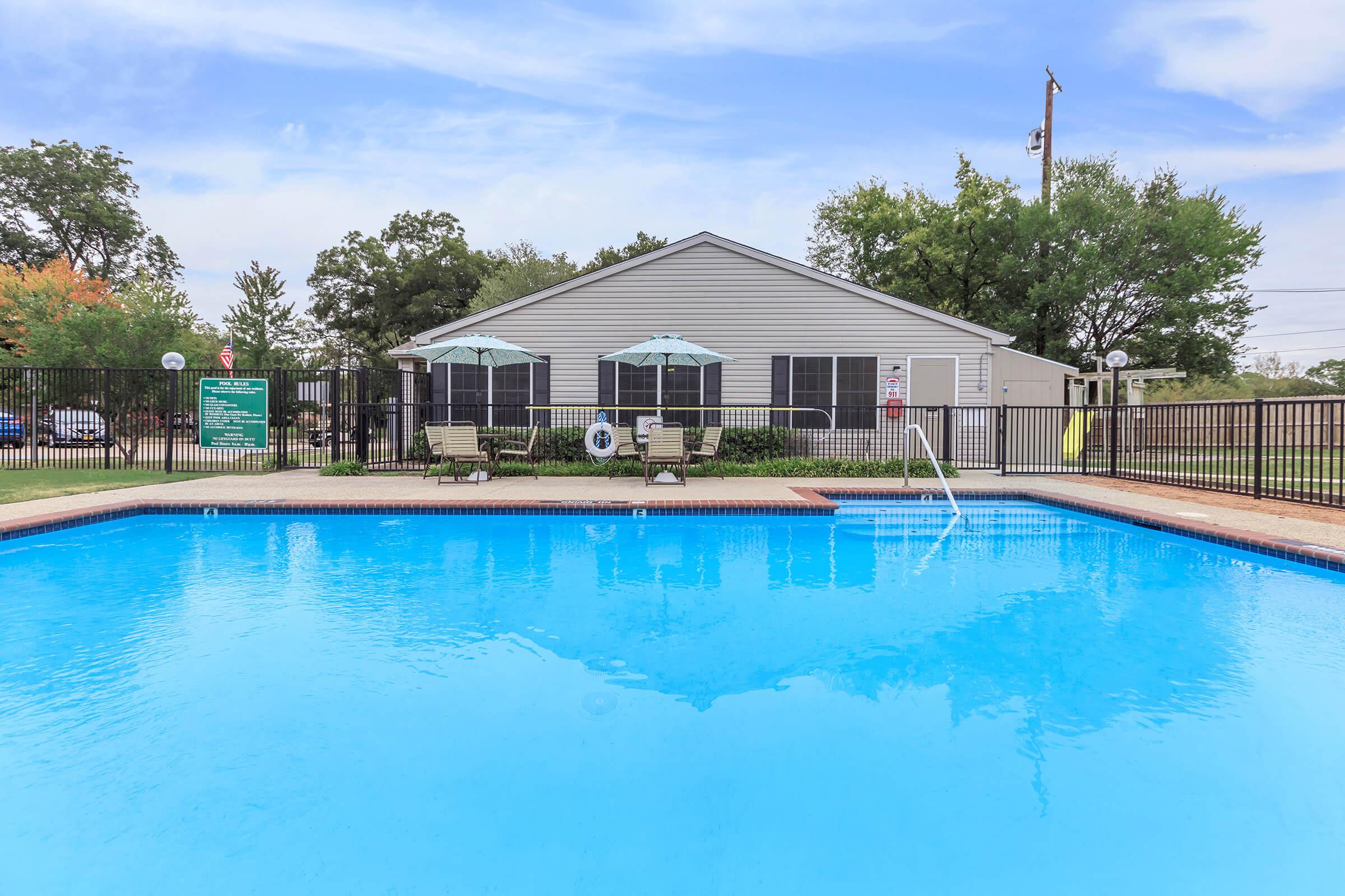 a pool next to a body of water