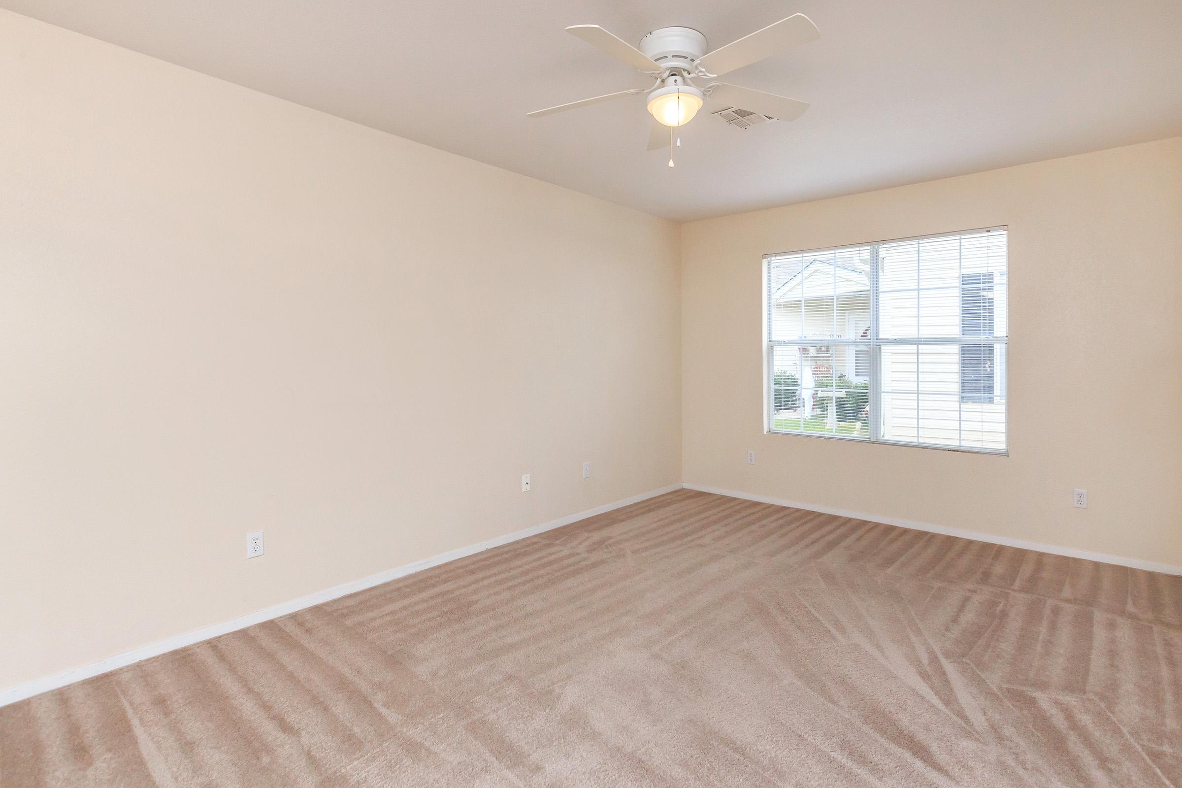 a bedroom with a bed in a room